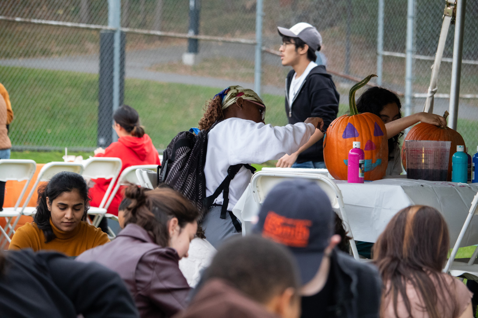 Students painting pumpkins.