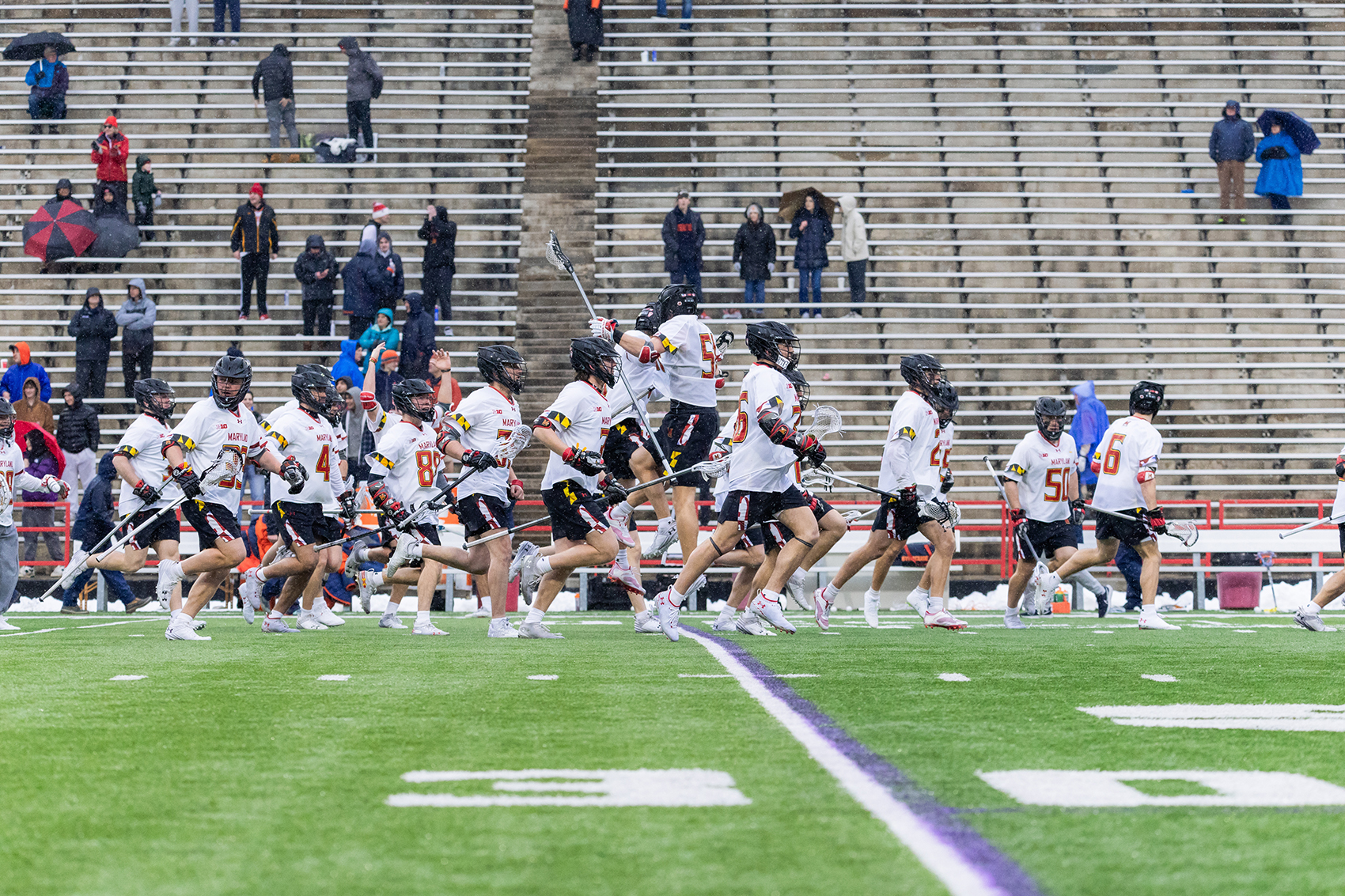 Maryland men’s lacrosse runs toward its cage in celebration following its 11-7 victory over Syracuse. UMD is now 7-0 against SU since head coach John Tillman took over the program in 2011, and the Orange are 0-4 versus the Terrapins in the Gary Gait coaching era. 