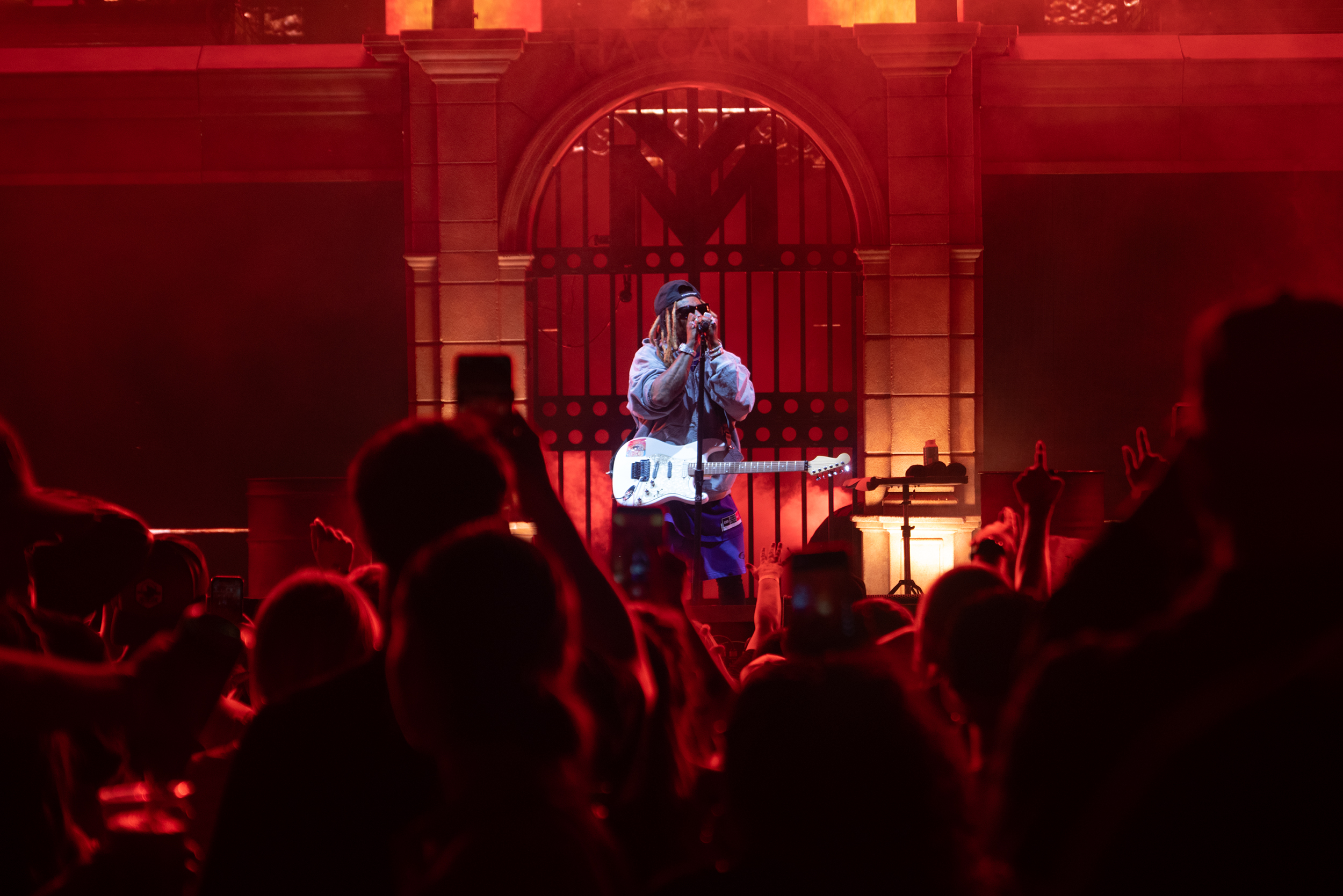 Lil Wayne raps with the crowd as he performs hits from his illustrious hip-hop career. His set list included songs like “Fireman” and “King Carter.”