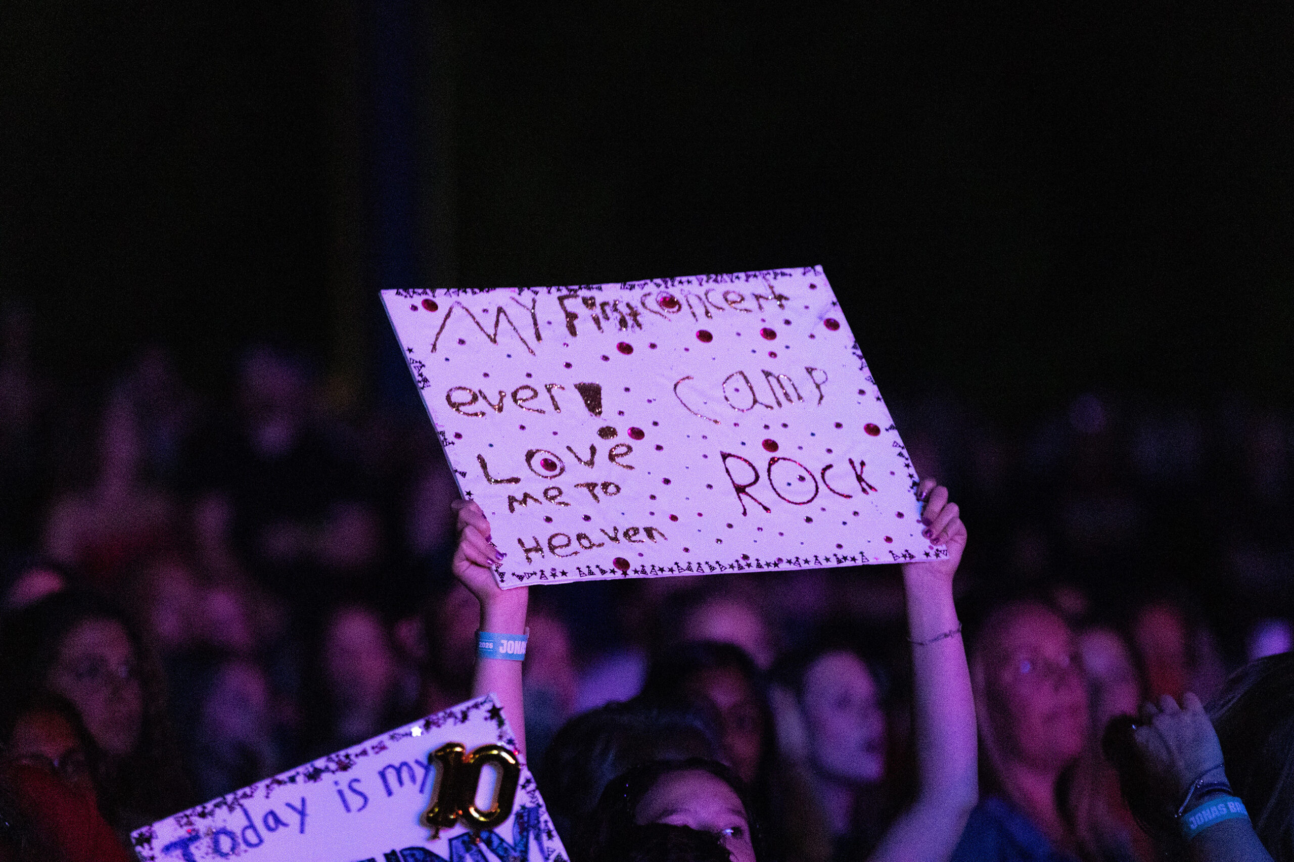 Some fans debut handmade bedazzled posters. Other fans cheered, danced and sang along with the Jonas Brothers’.