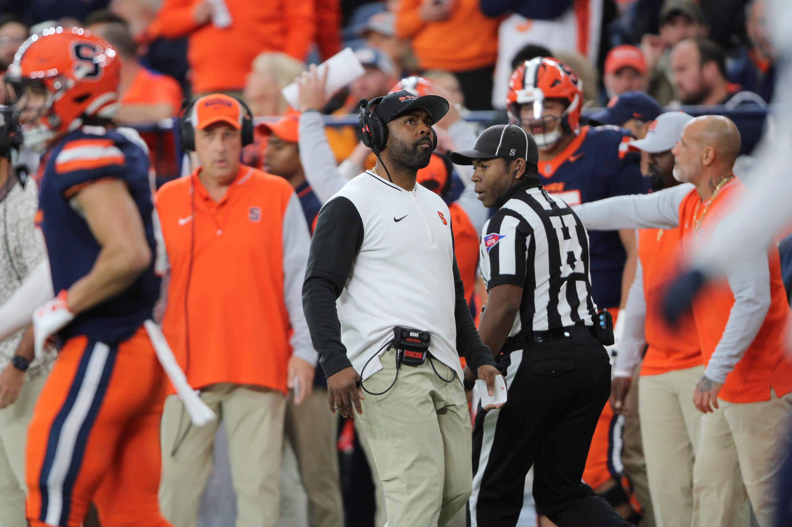 Photo of Syracuse Football Head Coach Fran Brown coaching during a home football game against the University of Connecticut.
