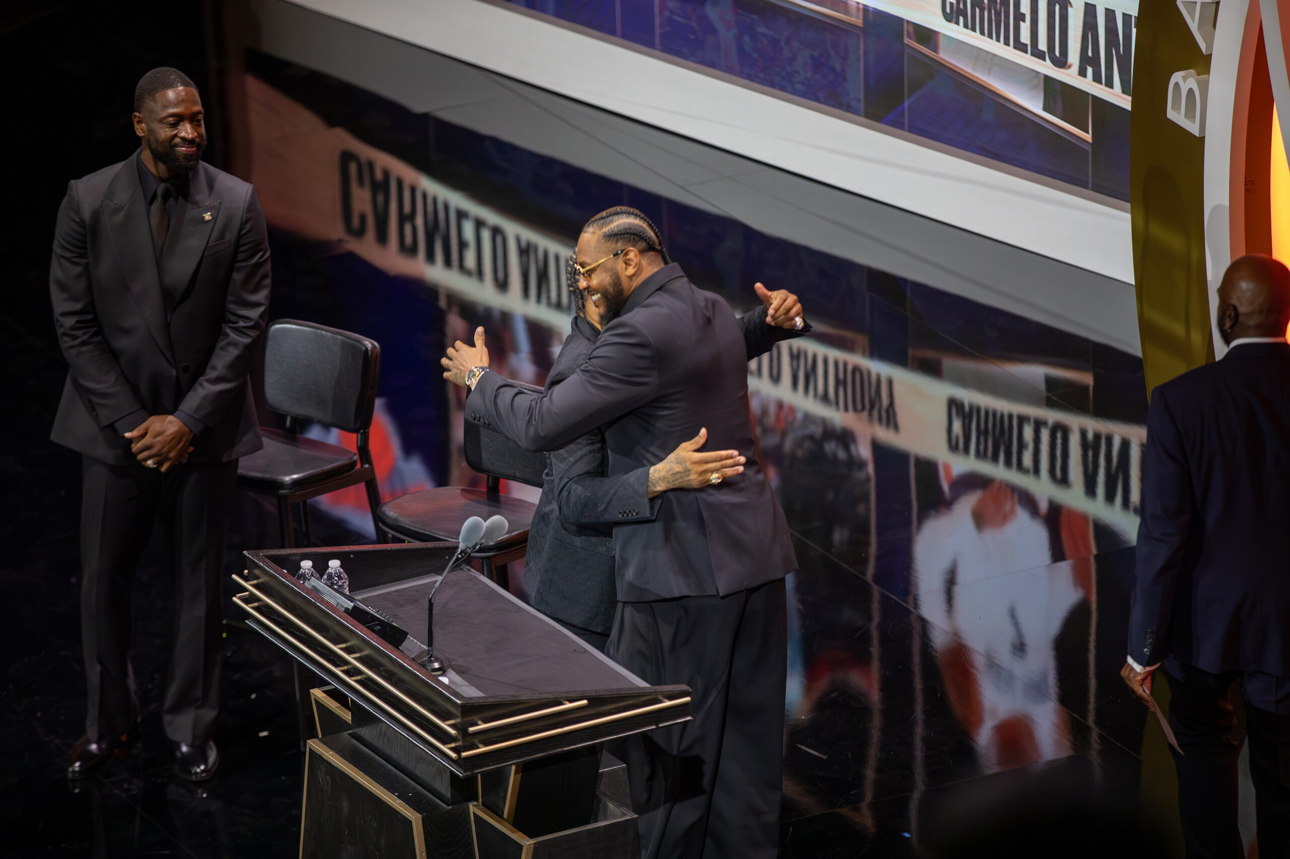 Anthony hugs Allen Iverson before delivering his Hall of Fame induction speech. Anthony selected Iverson and Dwyane Wade (left) as his presenters for the induction. 