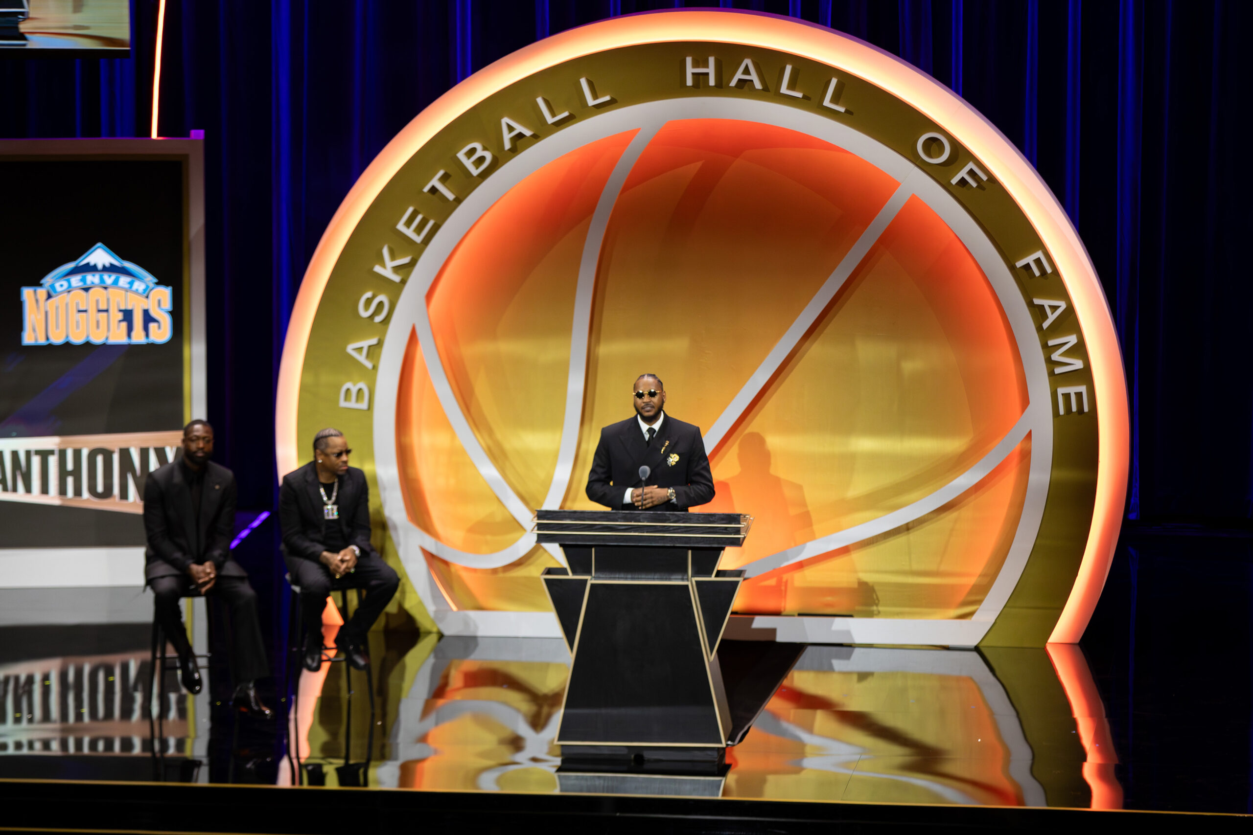 Carmelo Anthony stands on the stage at Symphony Hall, while giving his Hall of Fame induction speech. During his speech, Anthony reflected on his year at Syracuse, which was highlighted by winning the 2003 National Championship.