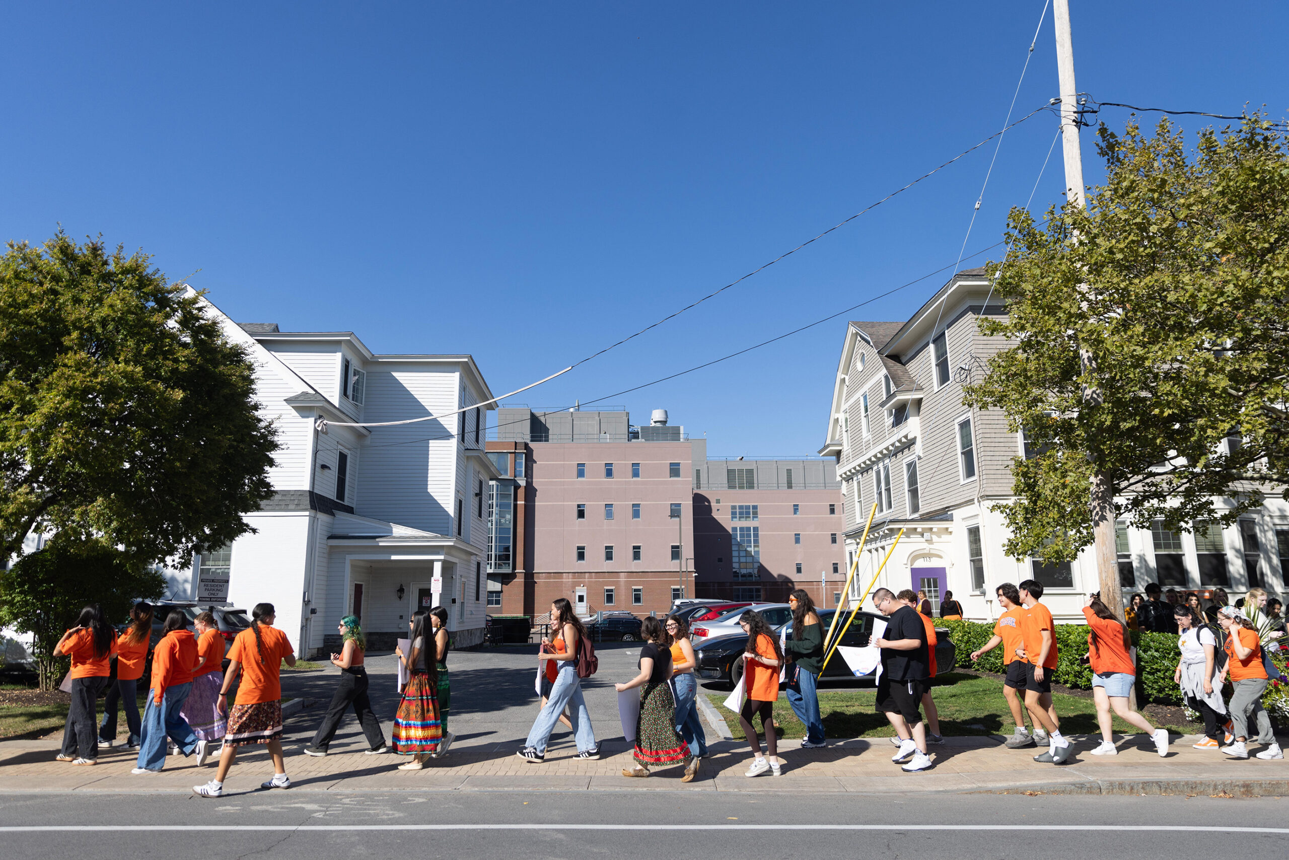 Demonstrators wearing orange shirts begin the walk down Euclid Avenue, heading toward College Place. Orange Shirt Day is observed annually on Sept. 30 to honor the survivors of the Canadian residential school system and Indian boarding schools in the United States.