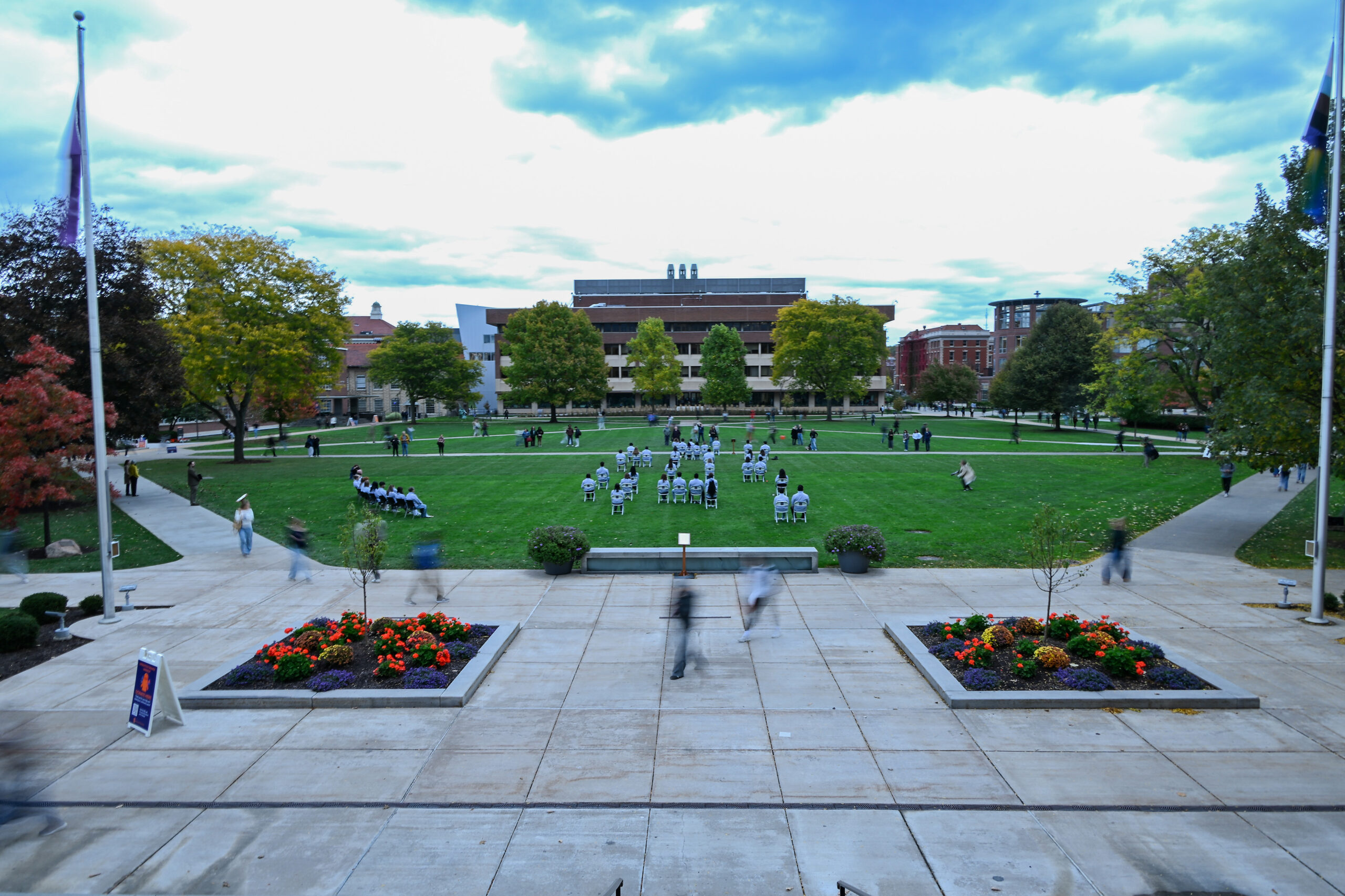 Remembrance Scholars sit quietly during “Sitting in Solidarity” for 35 minutes. The chairs on the Quad, in the formation of seats on Pan Am Flight 103, remained up throughout the week.