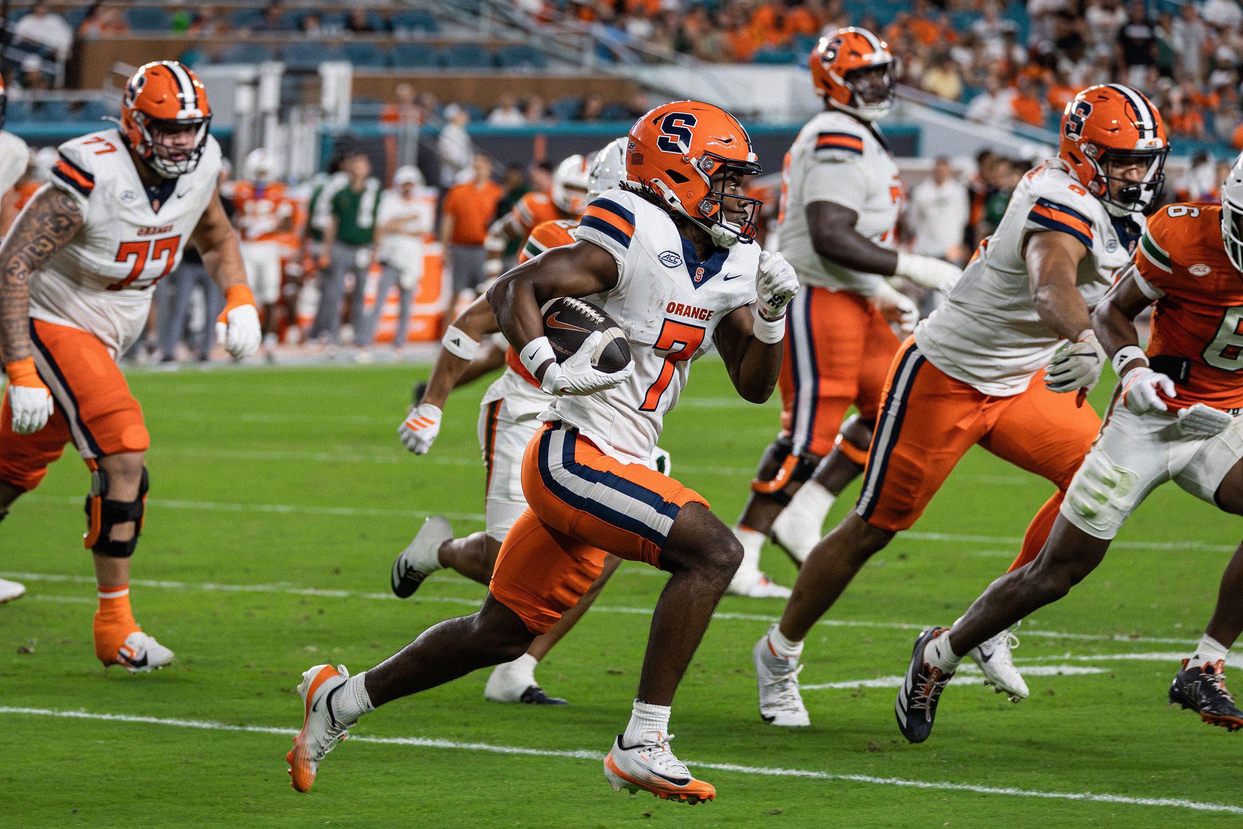 Syracuse wide receiver Darien Williams carries the ball in the fourth quarter of SU’s loss to Miami. Williams finished the game with two catches for 13 yards, one of nine Syracuse players to catch a pass. 