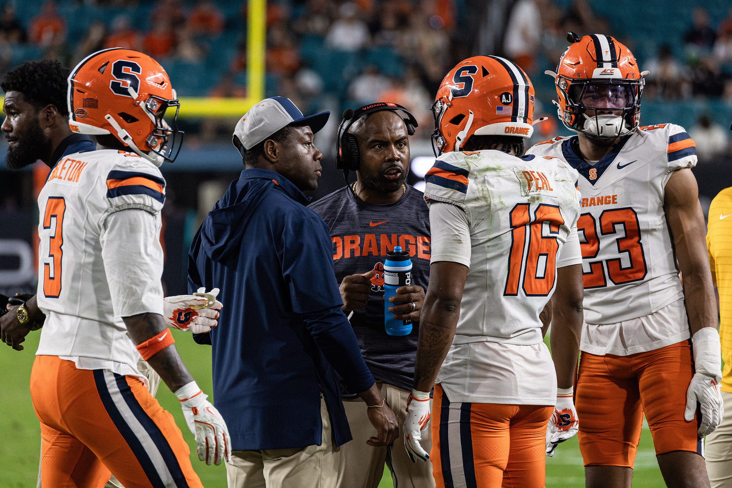 Brown speaks with cornerback Chris Peal during a timeout. The Orange’s pass defense allowed 261 yards through the air and two passing touchdowns, including a trick play caught by Miami quarterback Carson Beck.