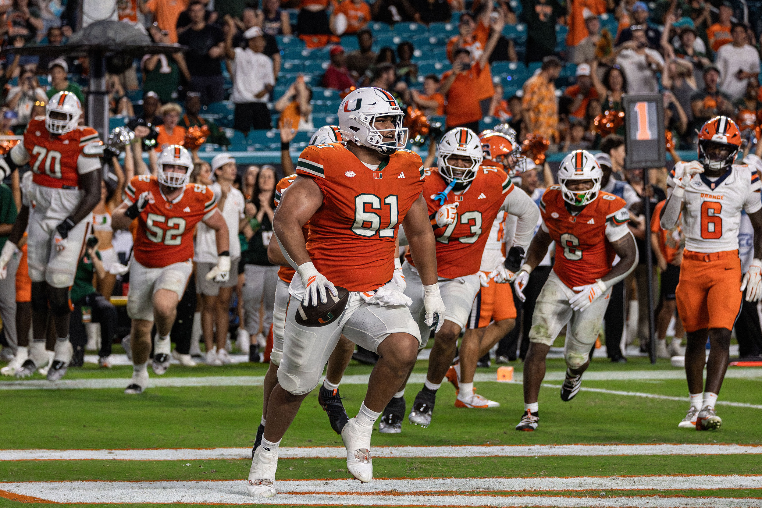 Miami offensive lineman Francis Mauigoa celebrates his fourth-quarter rushing touchdown. Mauigoa’s score put the Hurricanes ahead 38-3 with just under three minutes left, all but sealing Syracuse’s loss.
