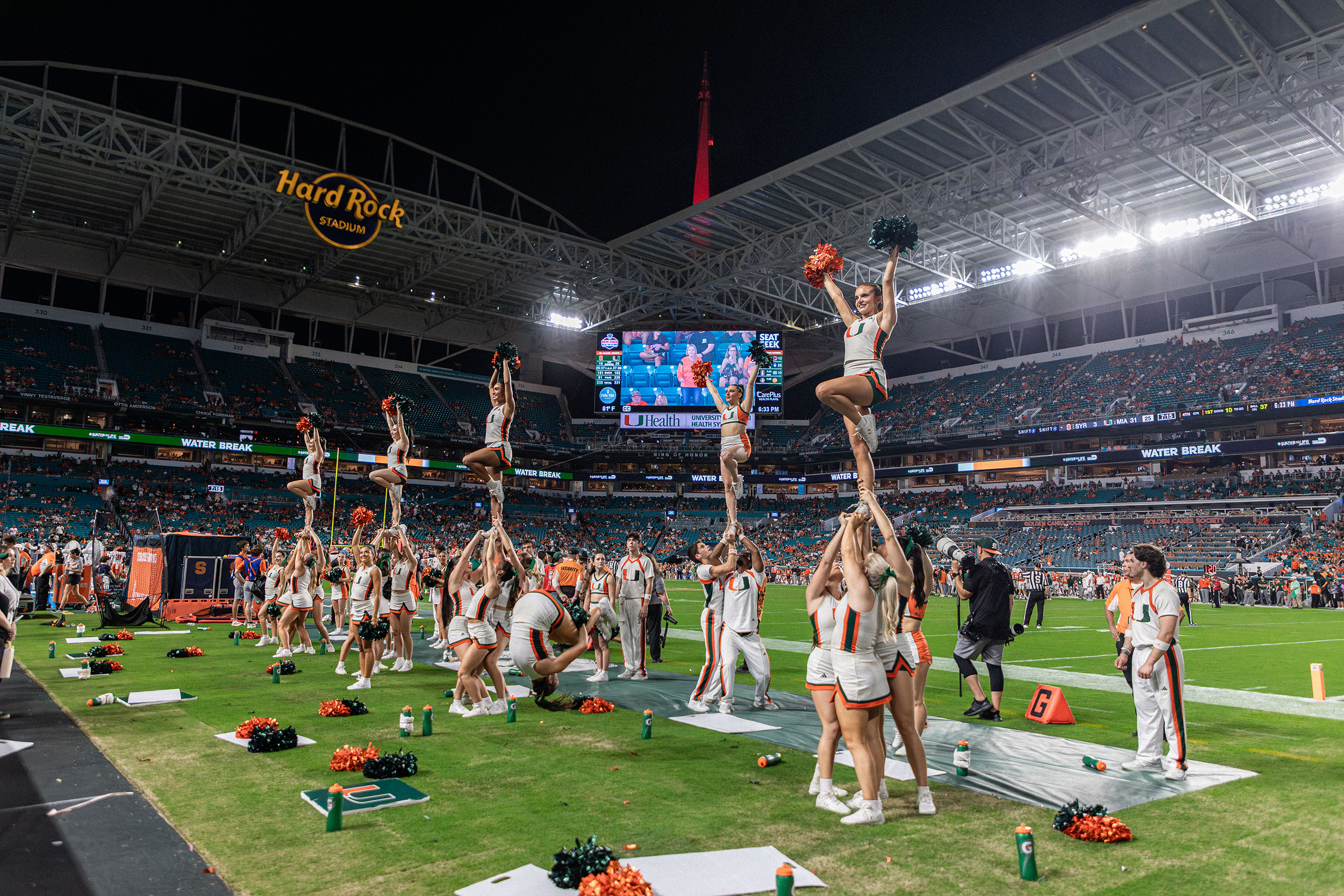Miami cheerleaders root on the Hurricanes on the sidelines of Hard Rock Stadium. Miami gained 385 yards of total offense in a blowout win over Syracuse.