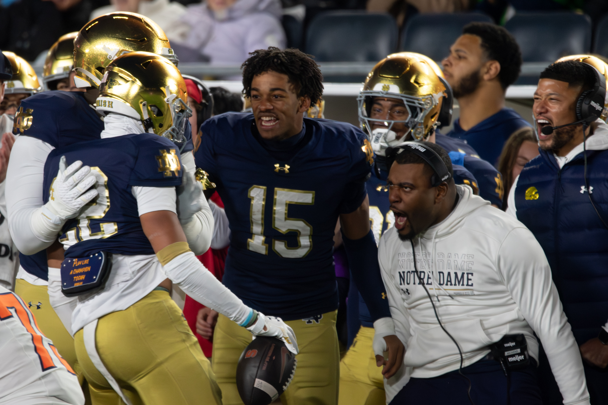 Notre Dame players and coaches celebrate with running back Aneyas Williams (22) after his fourth-quarter touchdown. Williams’ score extended the Fighting Irish’s lead to 63-0 with 13:32 left.