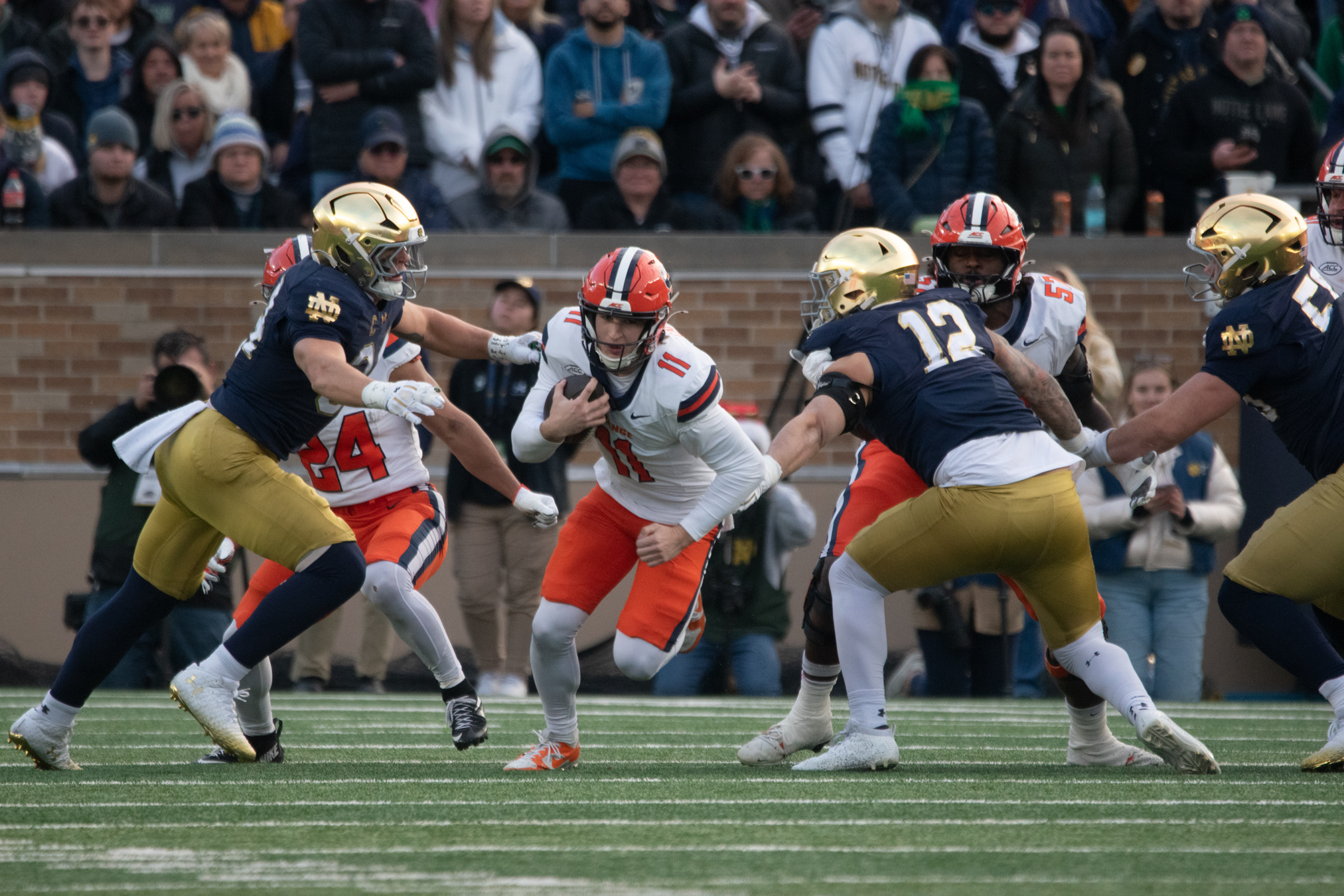 SU quarterback Luke Carney scrambles in the first quarter of Syracuse’s loss to Notre Dame. Carney briefly replaced Filardi under center, notching three carries and throwing four passes.