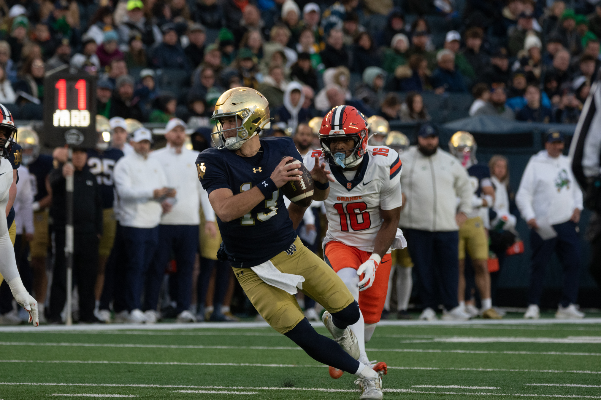 Notre Dame quarterback CJ Carr evades a blitz from SU defensive back Chris Peal. Despite ND’s historic 70-point outburst, Carr passed for a season-low 49 yards against the Orange.