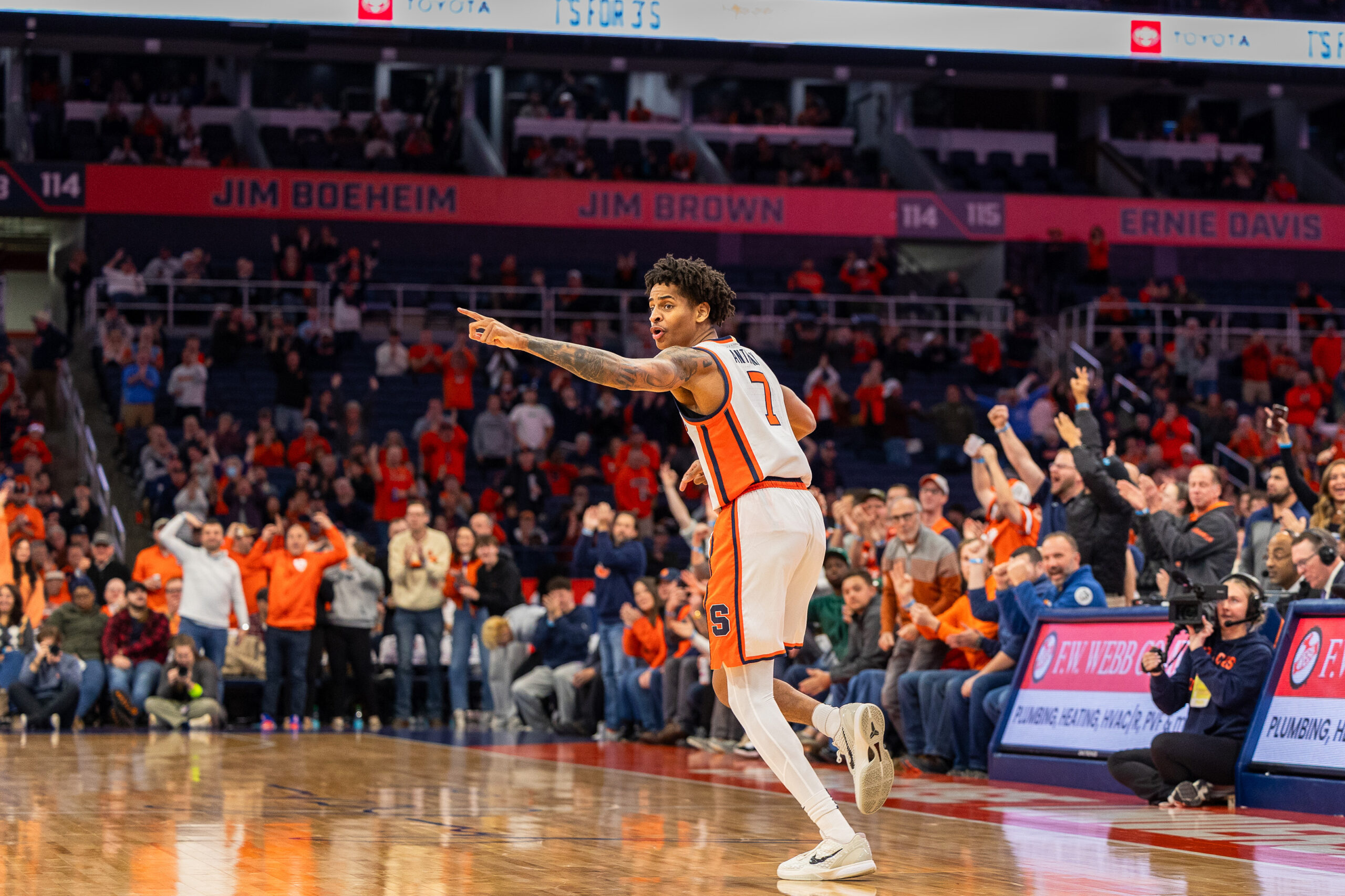 After sinking a bucket, Syracuse freshman Kiyan Anthony points to his teammates to get them back into position. Though he only posted seven points, Anthony still helped the Orange to their top-15 win.