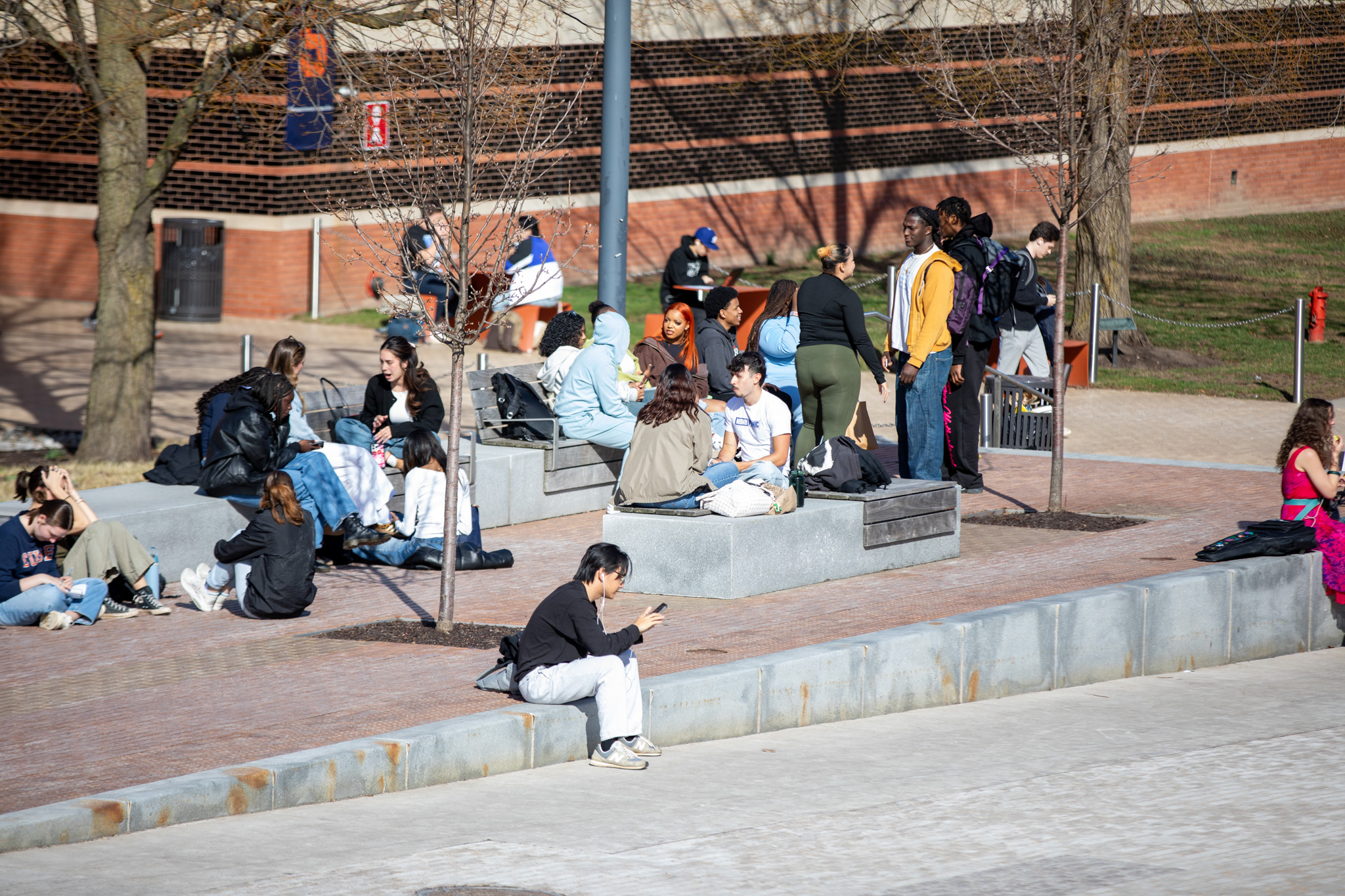 March: Students gather outside across Syracuse University’s campus to welcome the spring semester’s first sunny day. Syracuse’s snowy 2024-25 winter season won the New York’s Golden Snowball Award.