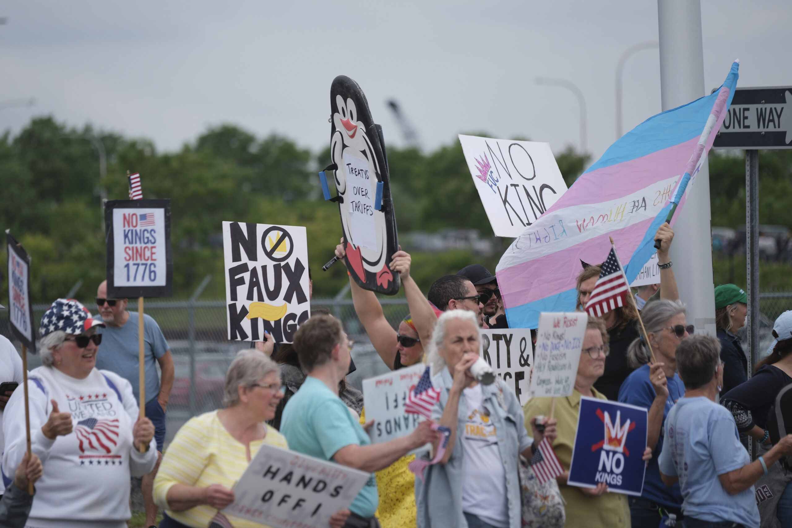 Summer: Protesters rally at Destiny USA, holding signs reading “No Kings” and “Their hands feed us,” referring to immigrants. Demonstrators in Syracuse joined more than five million people who participated in more than 2,100 cities and towns nationwide.
