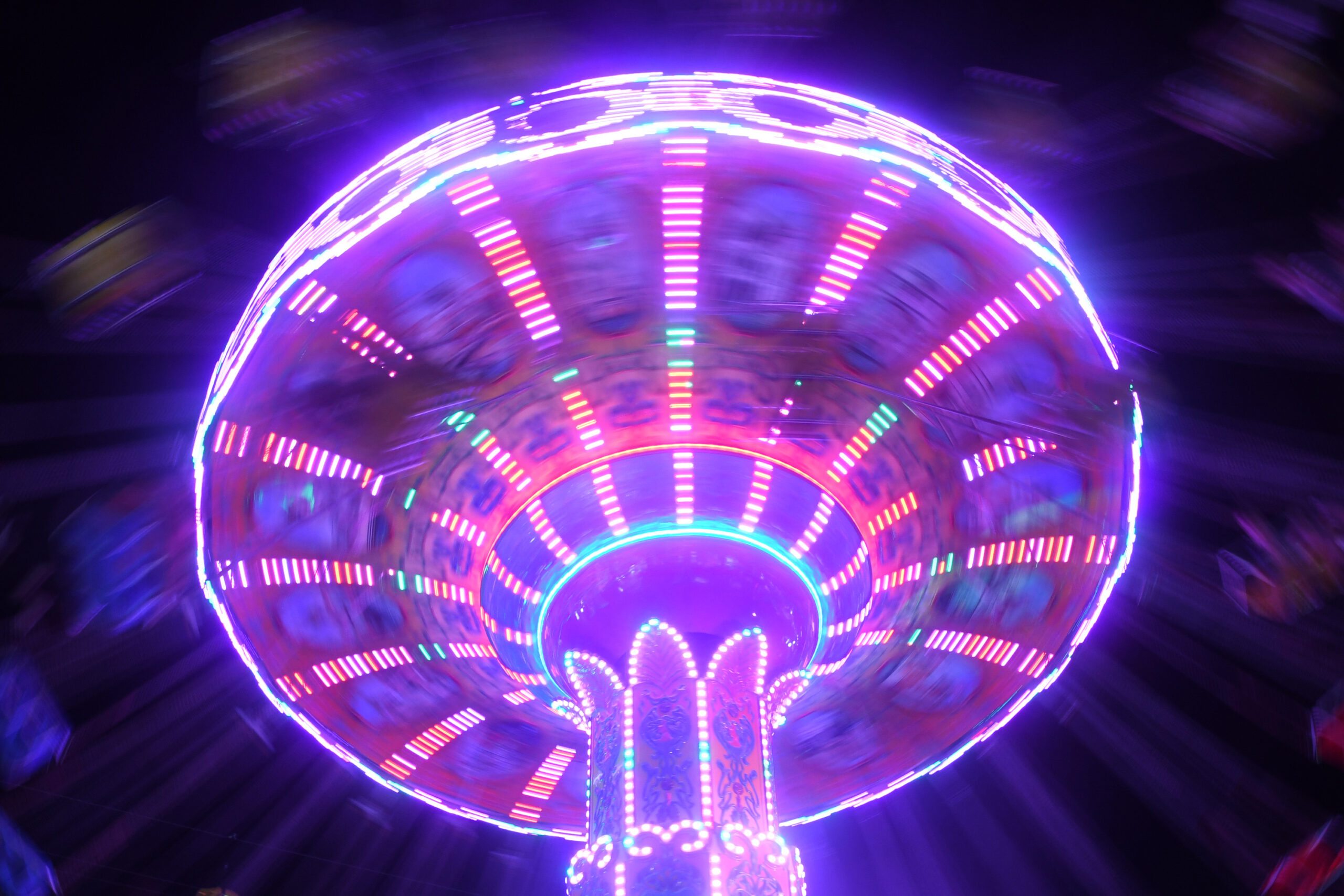 Summer: The light of a carnival ride streaks the night sky at the New York State Fair. The annual New York staple, jammed with rides, food and farm animals, ran this year from Aug. 26 until Labor Day.
