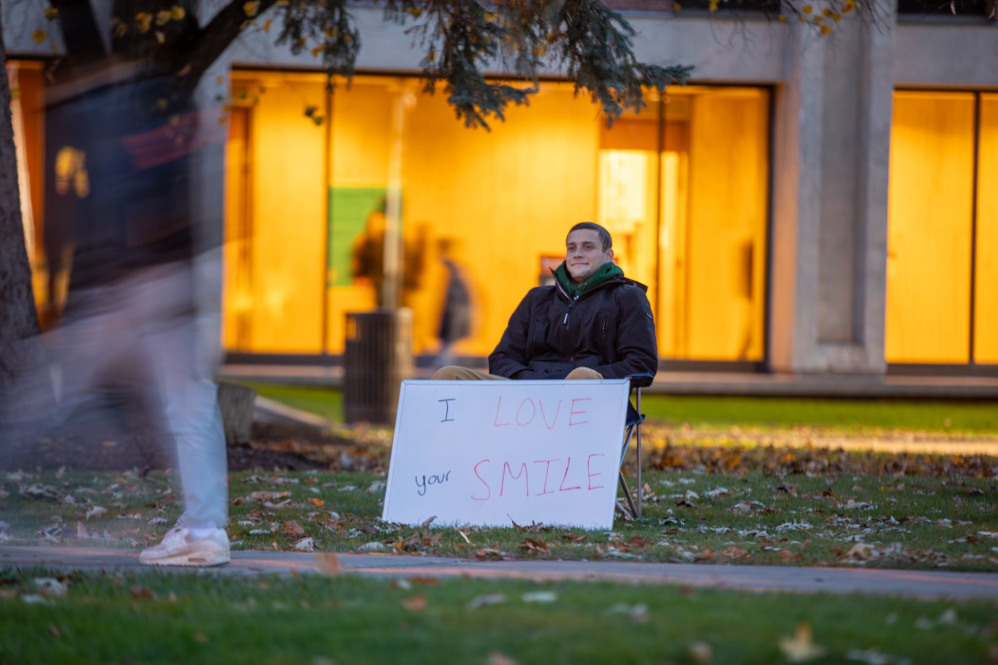 November: Syracuse University’s “Sign Guy” sits on the Shaw Quadrangle with positive messages. Passersby don’t always smile, wave or even acknowledge him, but he doesn’t mind since he knows he’s doing the right thing.