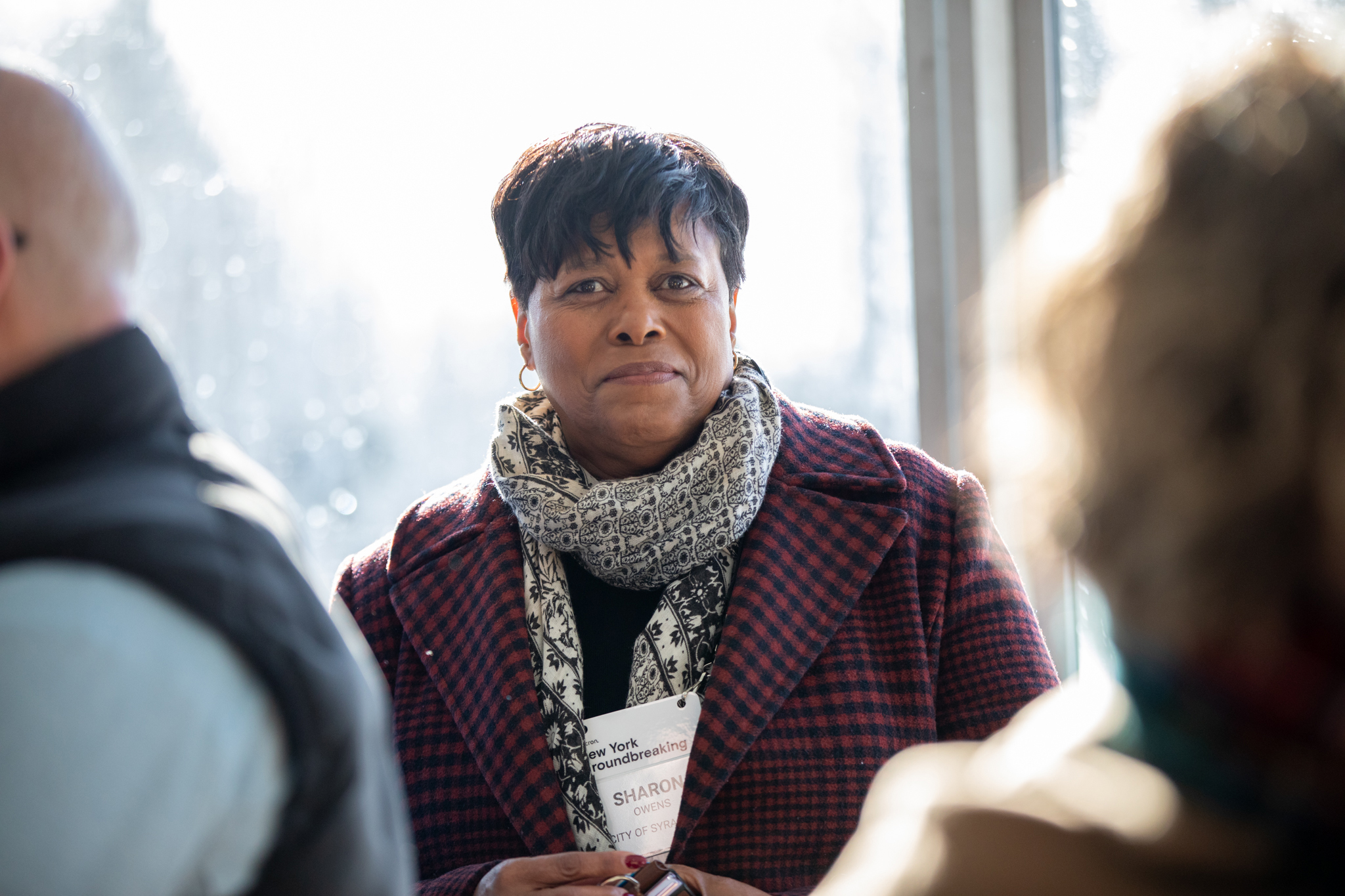 Syracuse Mayor Sharon Owens smiles at the camera ahead of Micron’s groundbreaking ceremony. Owens, surrounded by many New York state political mainstays, is a relative political newcomer who began her term as Syracuse mayor this month.
