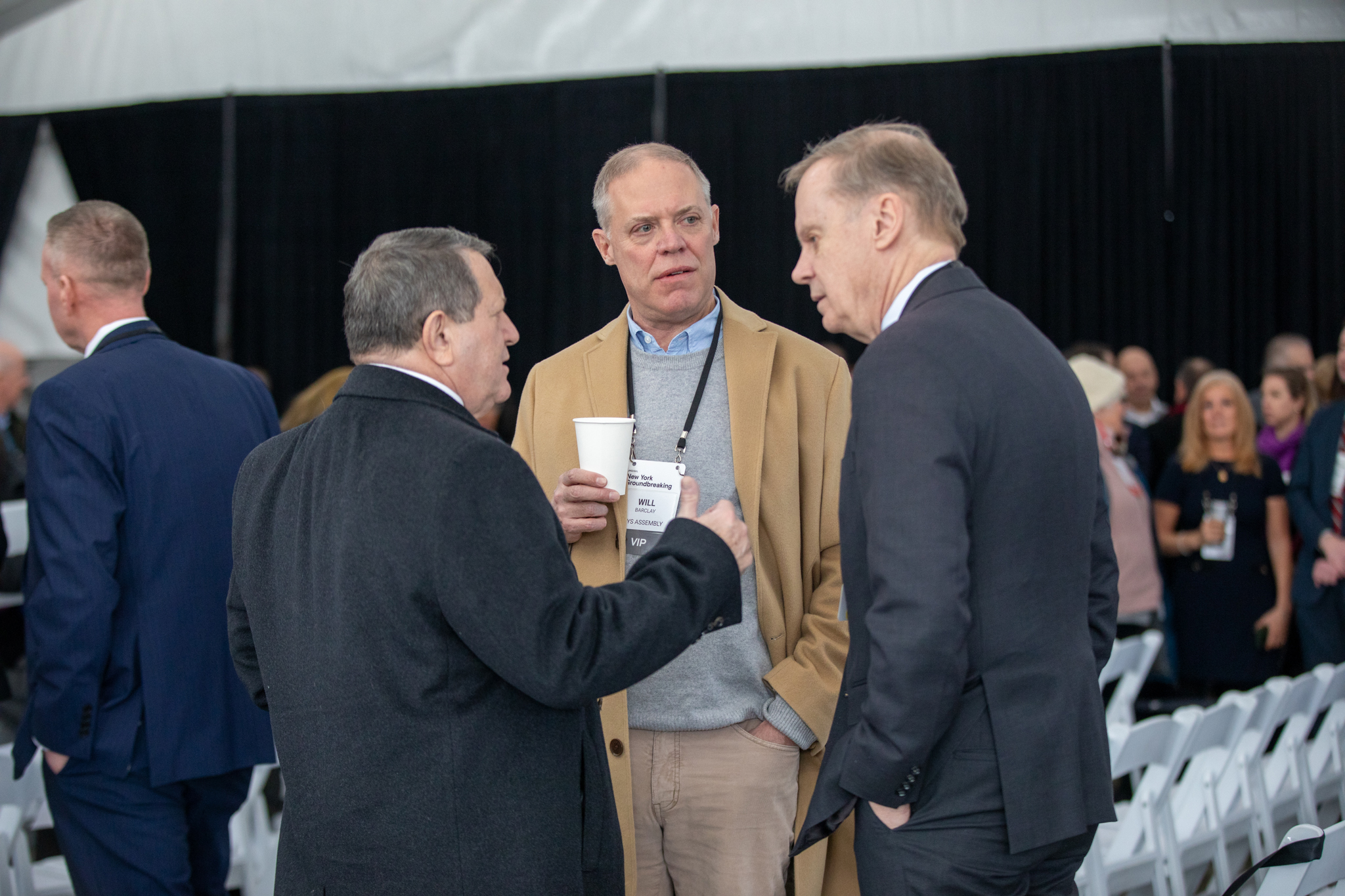 Syracuse University Chancellor Kent Syverud chats with attendees before the ceremony. Syverud made it to Micron’s event in upstate New York after beginning his week in Ann Arbor, Michigan, to accept his appointment as the University of Michigan’s next president.