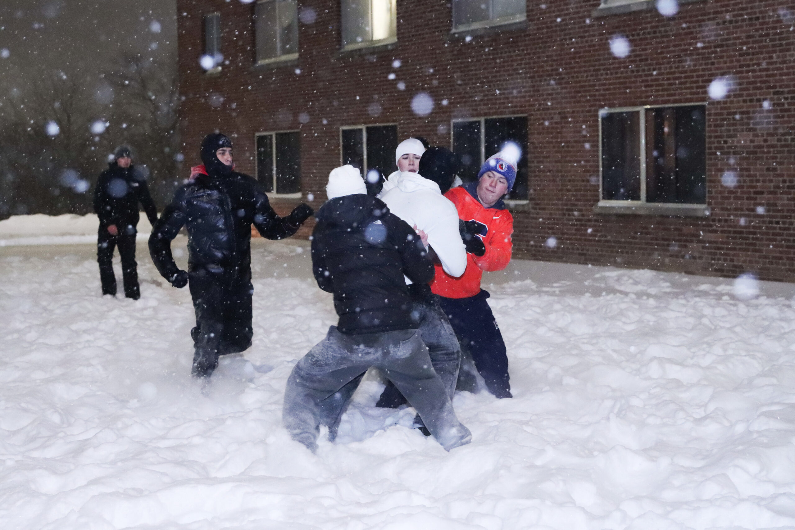 With classes canceled students rejoice outside Flint Hall with a snowball fight and an impromptu football game. Students enjoyed the winter weather and their free time without classes.