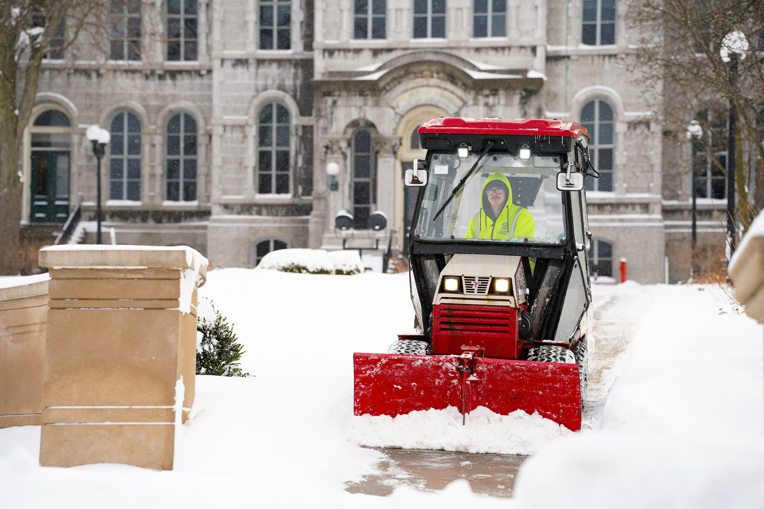 SU groundskeepers clear pathways around campus. SU’s Facilities Services department worked to ensure safe transportation across campus.
