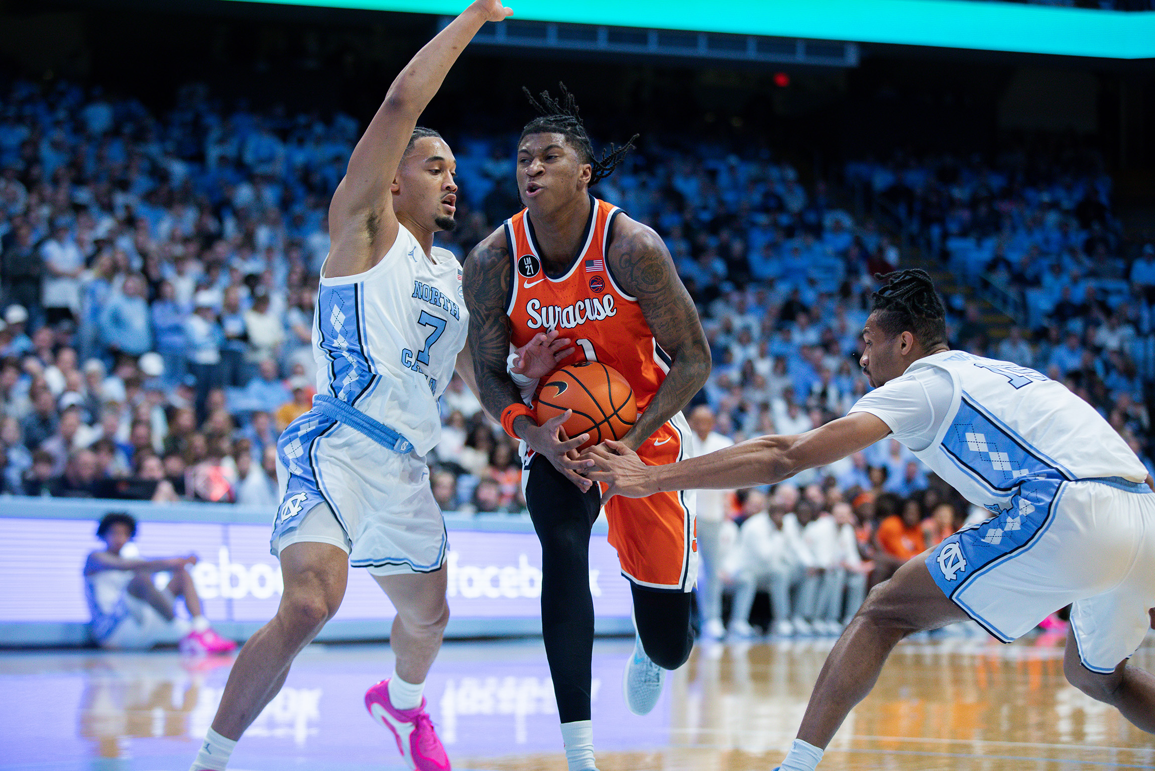 Donnie Freeman attacks the lane against UNC’s Seth Trimble. Though Freeman scored a game-high 23 points, the Orange’s only lead of the game was when they held a 2-0 advantage.
