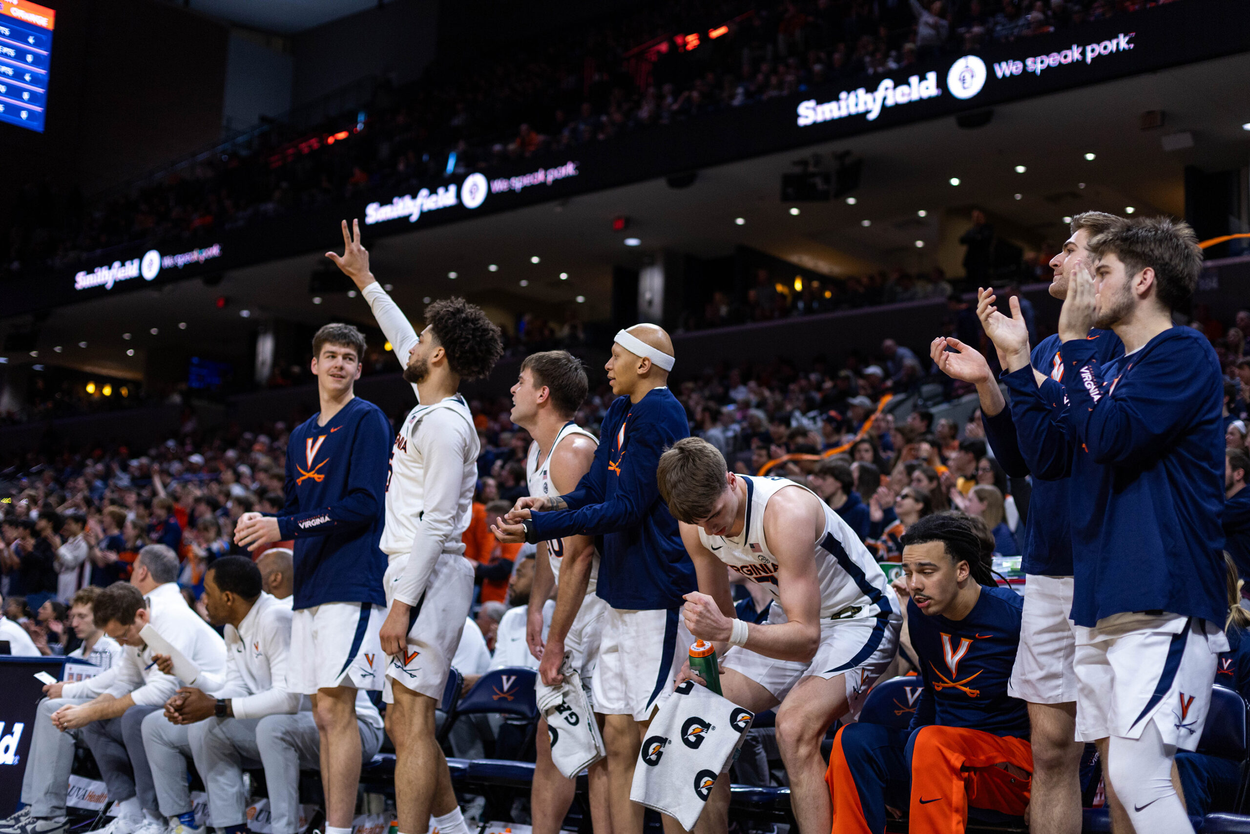 Virginia’s bench celebrates during its game against Syracuse, in which it clinched its 20th win under first-year head coach Ryan Odom. The Cavaliers’ victory was powered by their advantage on the offensive glass and from beyond the arc. 