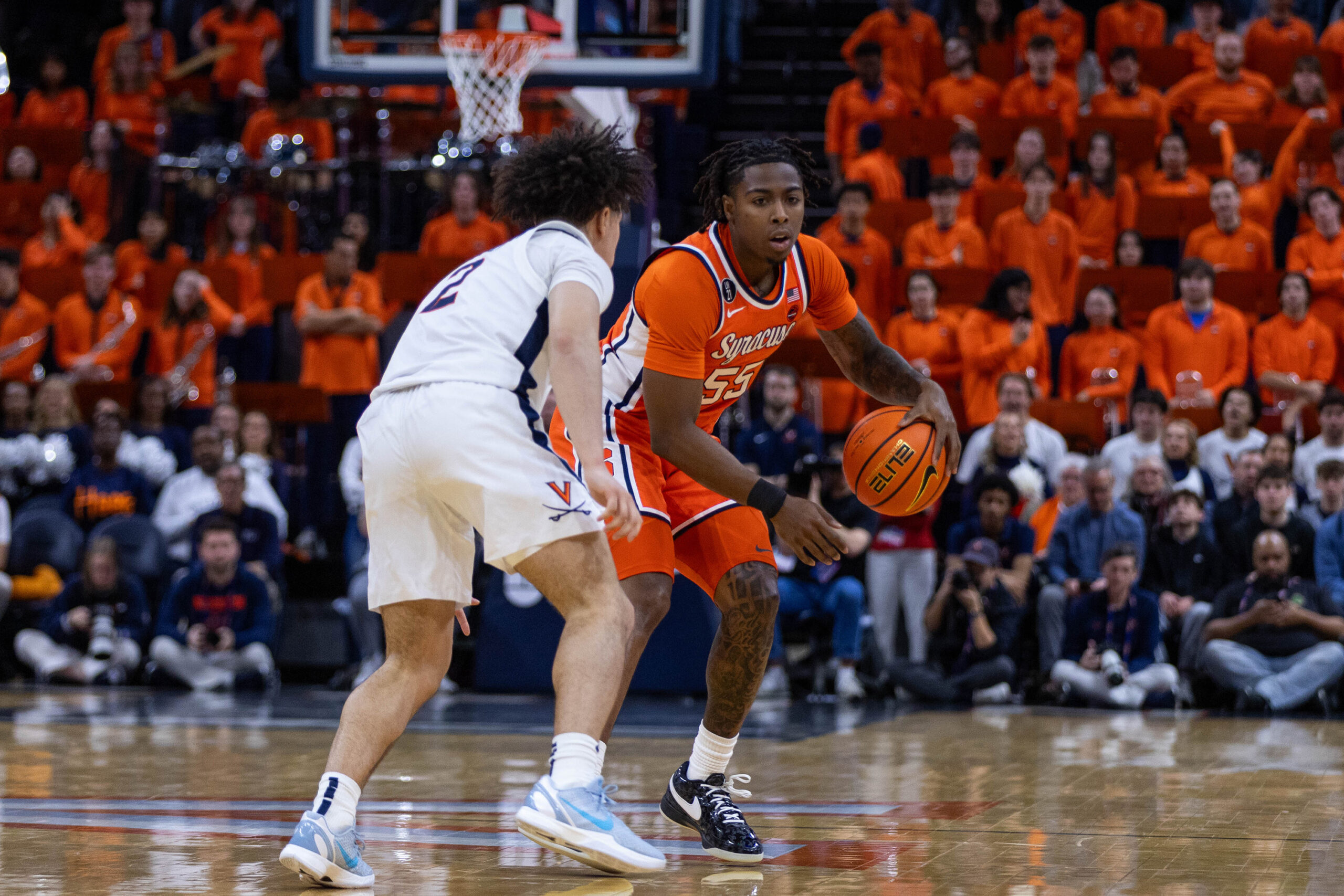 Bryce Zephir handles the ball at the top of the key while guarded by UVA’s Chance Mallory. While Anthony registered his first game without playing, Zephir’s nine minutes against the Cavaliers were his second-most in a conference game this season.