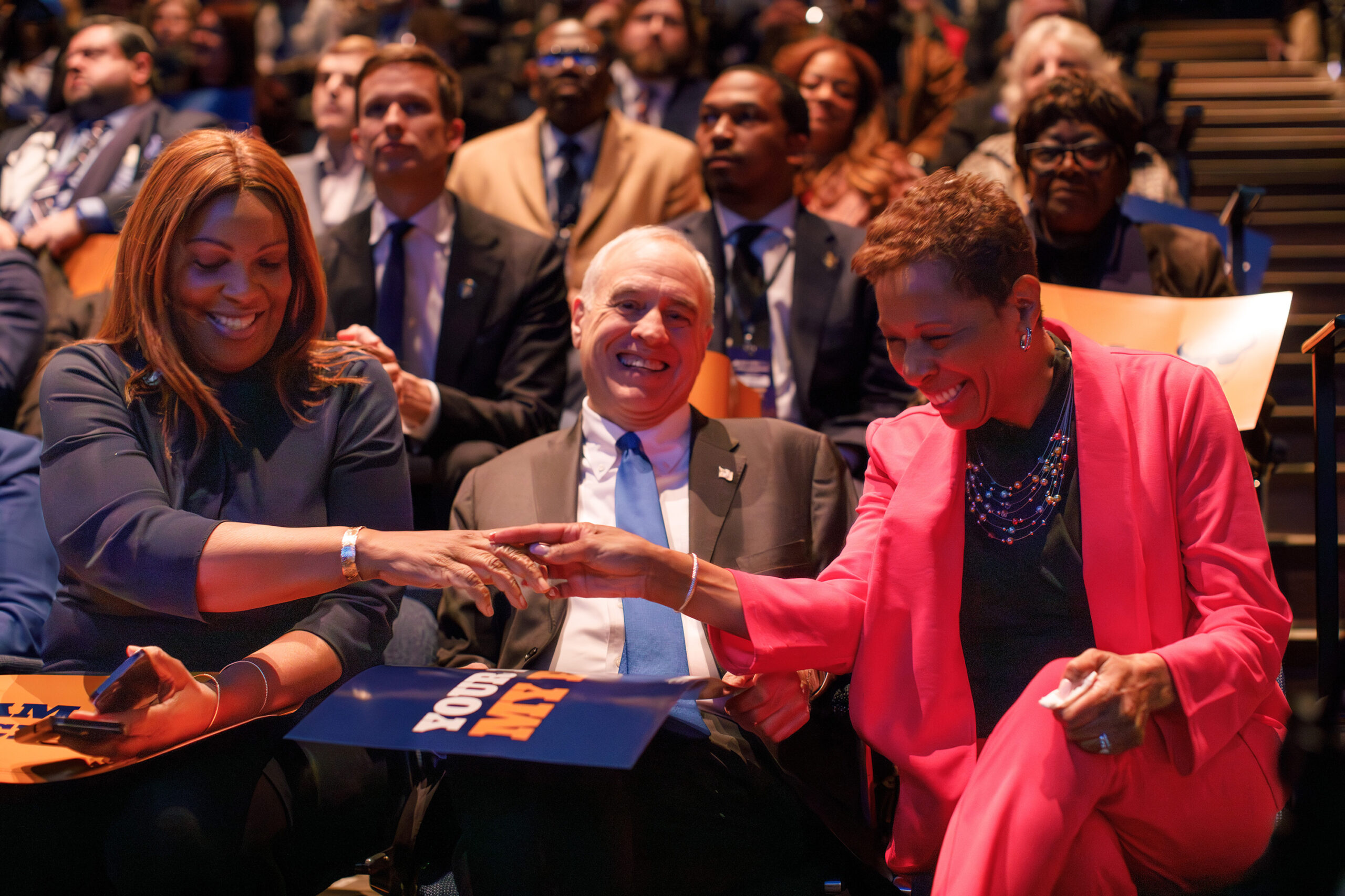 New York Attorney General Letitia James, Comptroller Tom DiNapoli and Hochul’s running mate, Adrienne Adams, (left to right) laugh and shake hands during the convention.