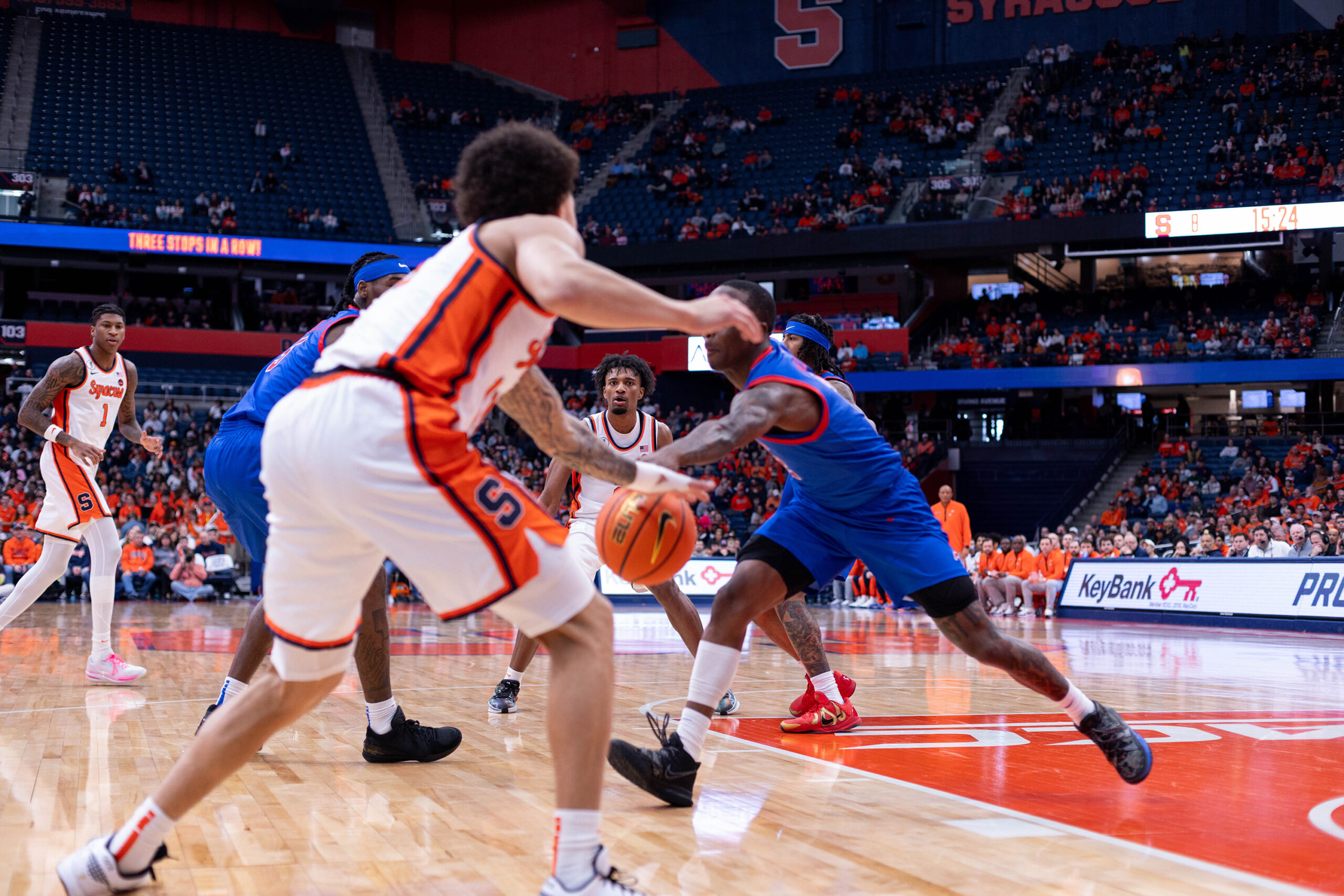 Syracuse men’s basketball guard Naithan George reaches for a loose ball during the Orange’s one-point triumph against SMU Saturday. In a team-high 37 minutes on the court, George scored 16 points, dished out six assists and grabbed four rebounds.