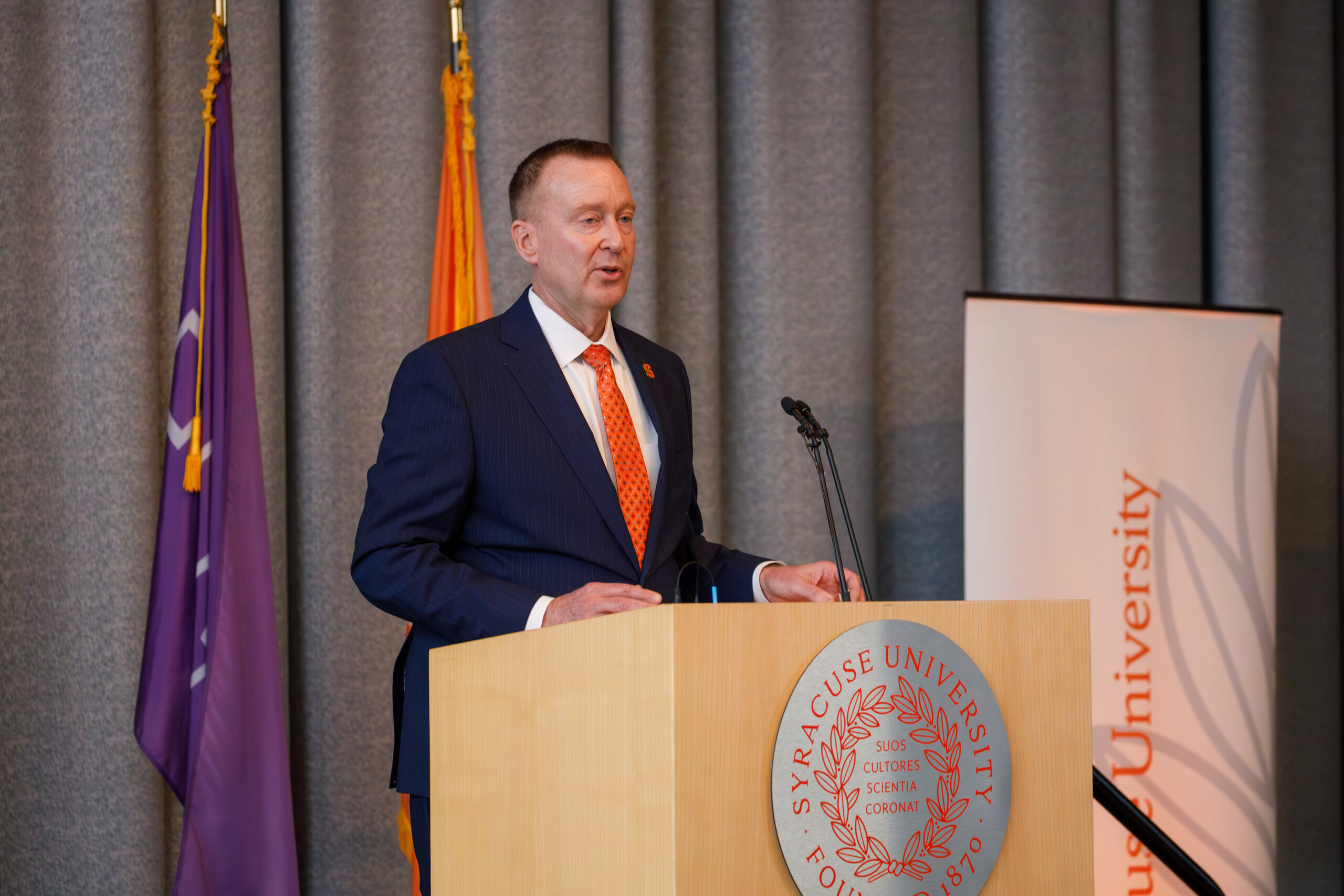 Mike Haynie, currently SU’s vice chancellor for strategic initiatives and innovation and executive dean of the Whitman School of Management, takes the podium. Speakers praised his leadership during the university COVID-19 response and his innovative founding of the Creator Economy.