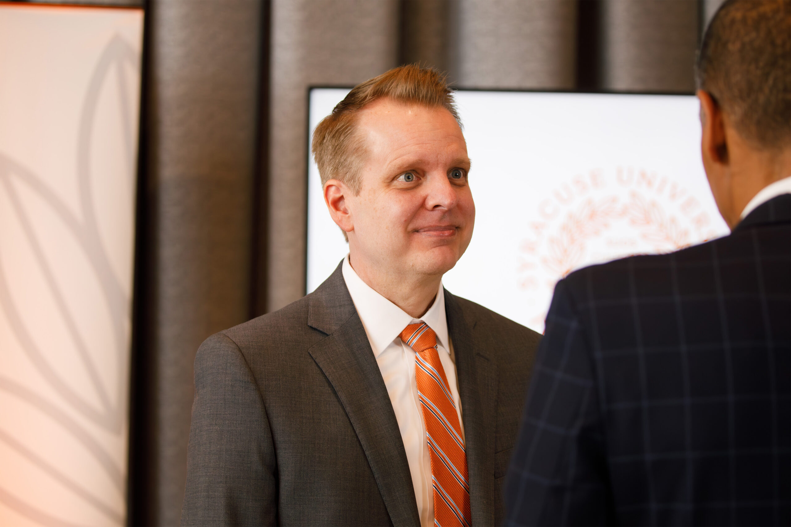 Haynie’s partner, Kevin Clark, mingles with university leadership during the event. Clark accompanied Haynie as he celebrated his new appointment.