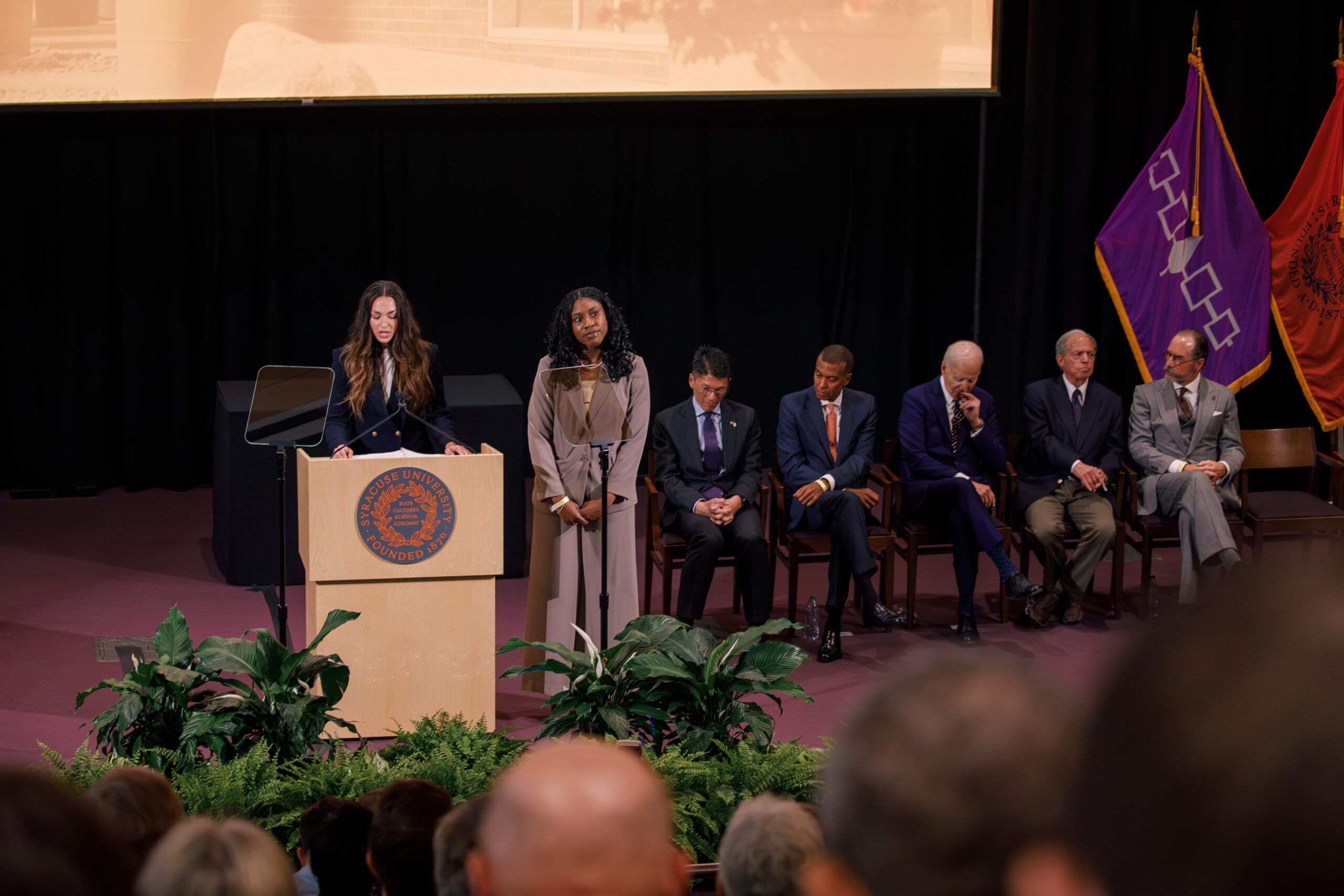 Emery Bielecki, president of the College of Law’s Student Bar Association, introduces Biden before his remarks. Kayzjah Charles, the School of Law’s class of 2026 president, spoke alongside Bielecki as the student representatives during the ceremony.