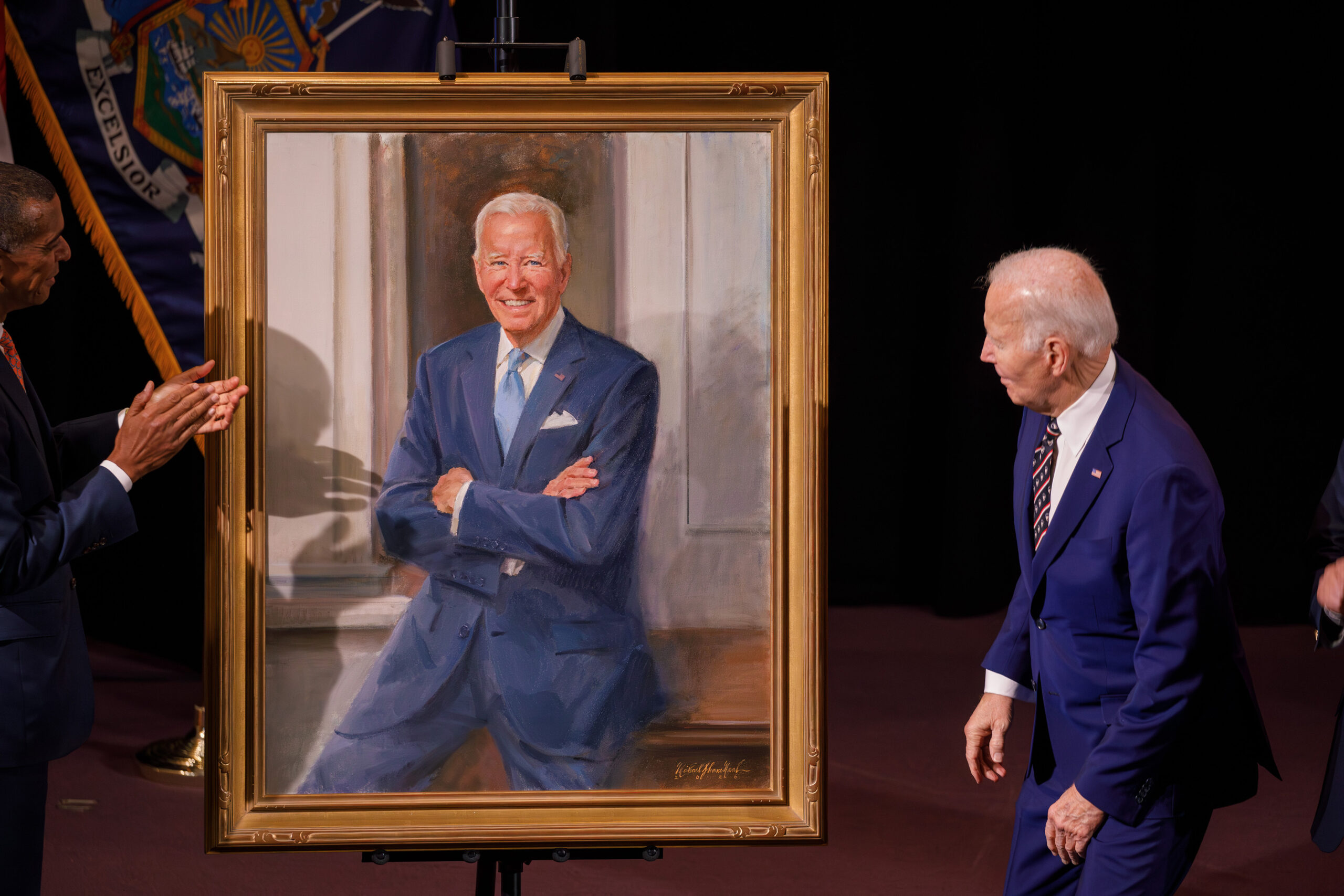 Biden examines his portrait, painted by Neal, whose art hangs in the National Portrait Gallery. During his remarks, Neal said he hoped to portray the president’s openness as a leader as well as his courage and determination.