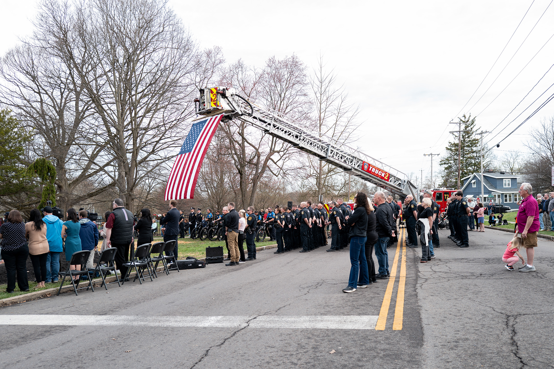 The Syracuse Fire Department Station Truck 2 stands alongside officers and attendees during Tuesday’s unveiling. The ceremony took place at the statues’ permanent location at James Pass Arboretum, a city park in the South Side of Syracuse.

