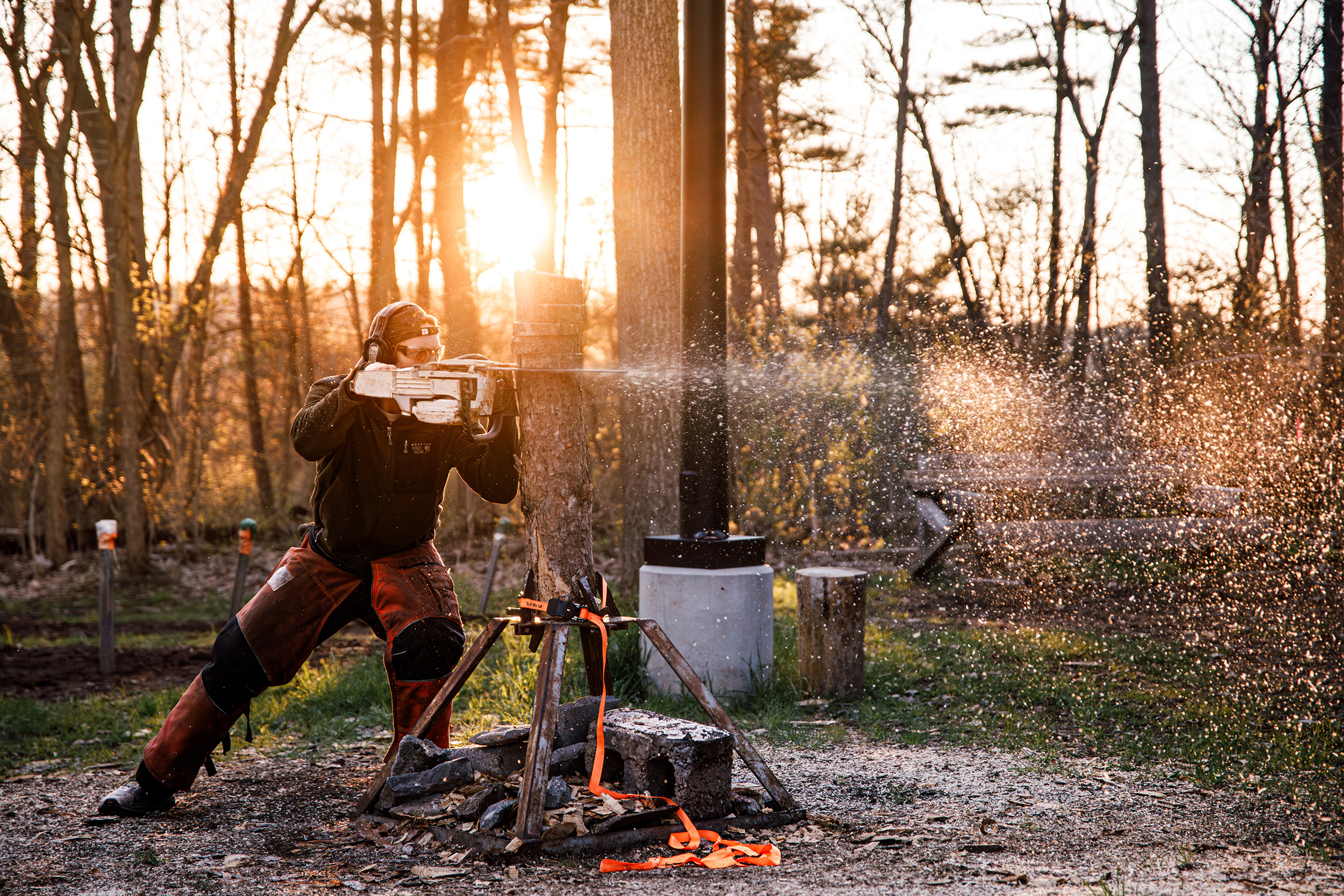 An ESF woodsman practices the cookie cut event. In cookie cut, the competitor tries to complete as many horizontal slices as possible in a given amount of time — 15-20 cuts is considered impressive.