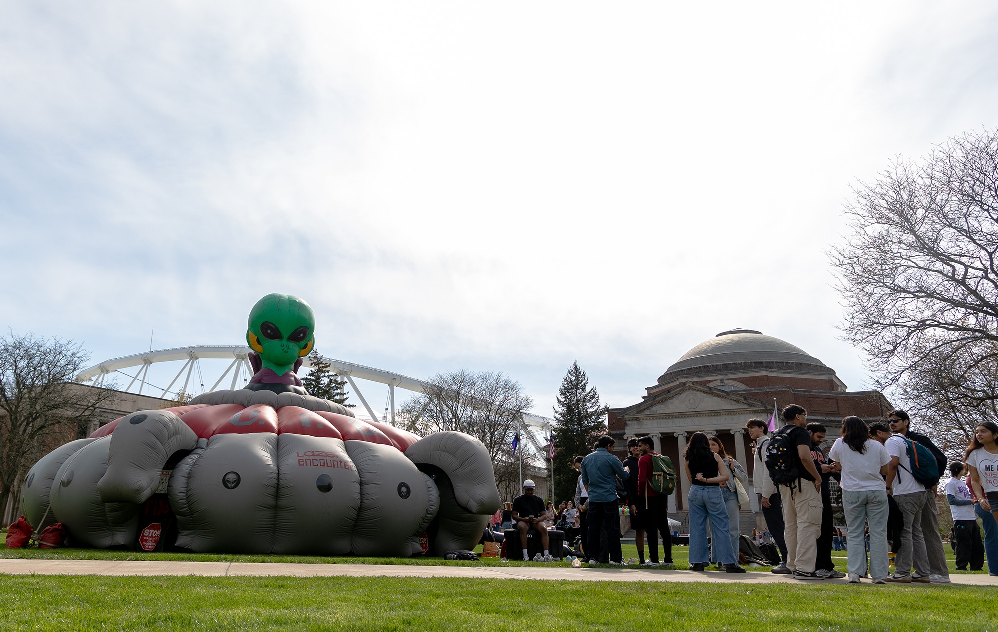 Students line up for laser tag in an inflatable alien Gravitron on the Shaw Quadrangle. SoundCheck also featured an inflatable obstacle course for students to navigate.