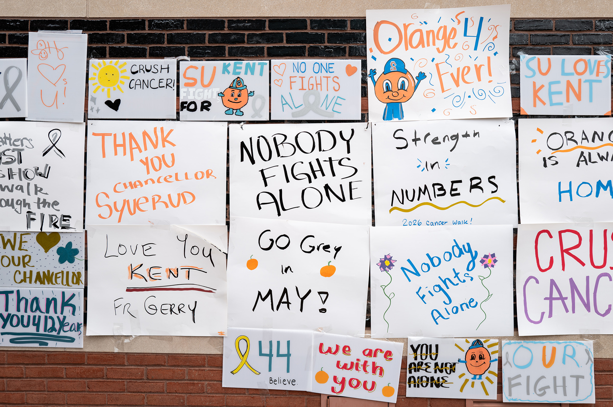 SGA displays the visitors’ posters on one of Schine Student Center’s walls, leaving encouraging messages for Syverud. By the end of the event, over 30 signs covered the bricks — despite gusts of wind nearly knocking them down.