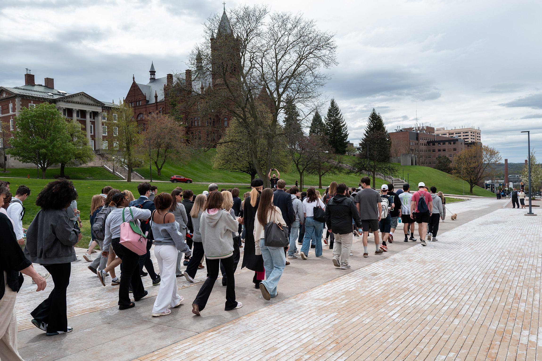 Supporters begin their short trek on the Einhorn Family Walk in solidarity with the outgoing chancellor. A majority of the group donned gray clothing, the official color of brain cancer and tumor awareness.