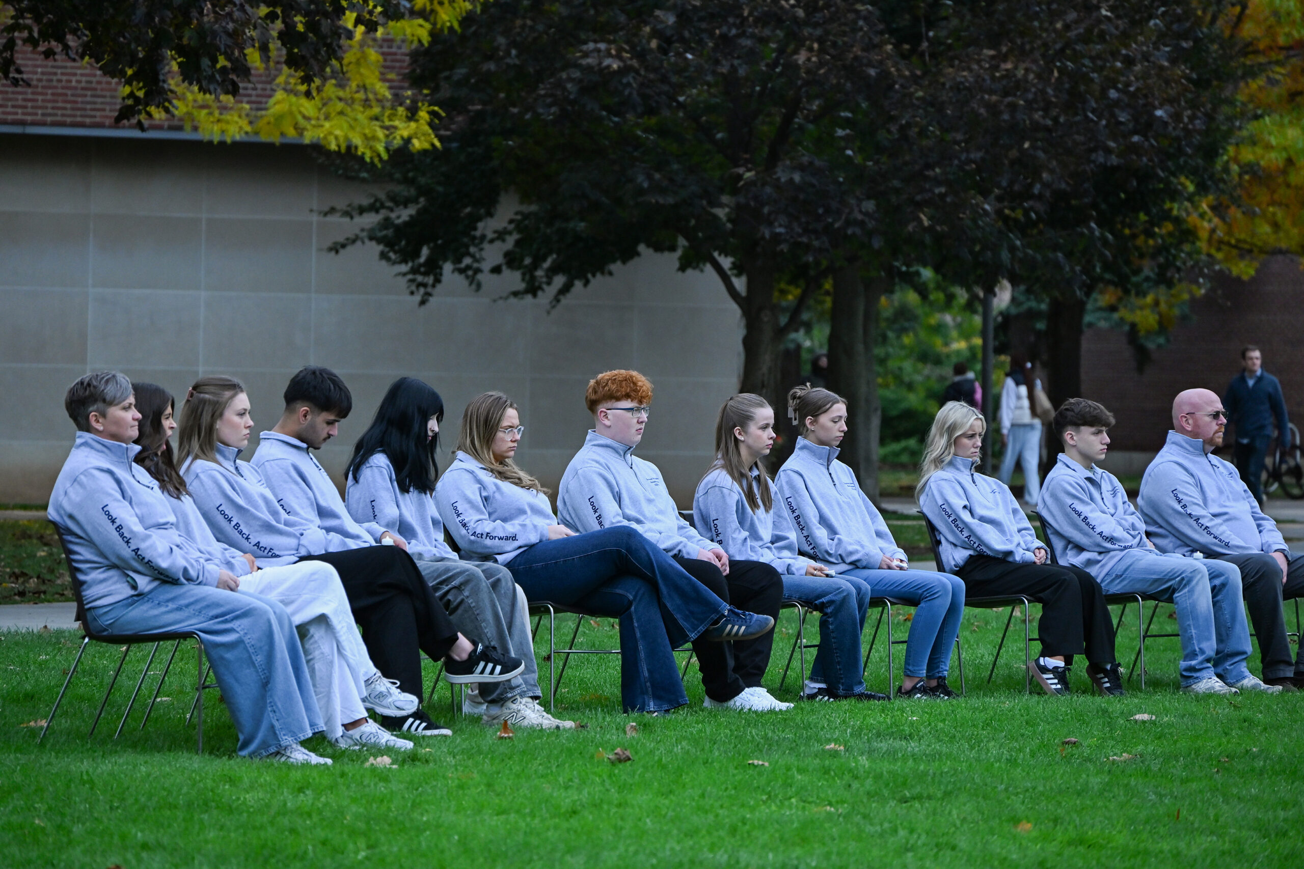 sitting outside group of people