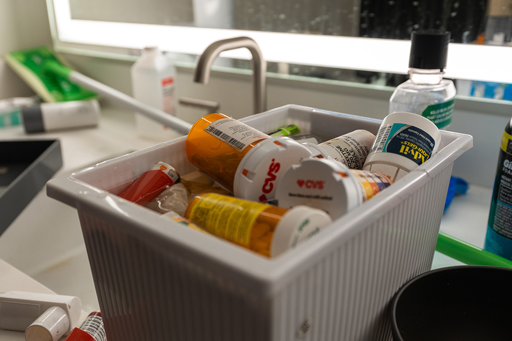 Bin full of medication bottles