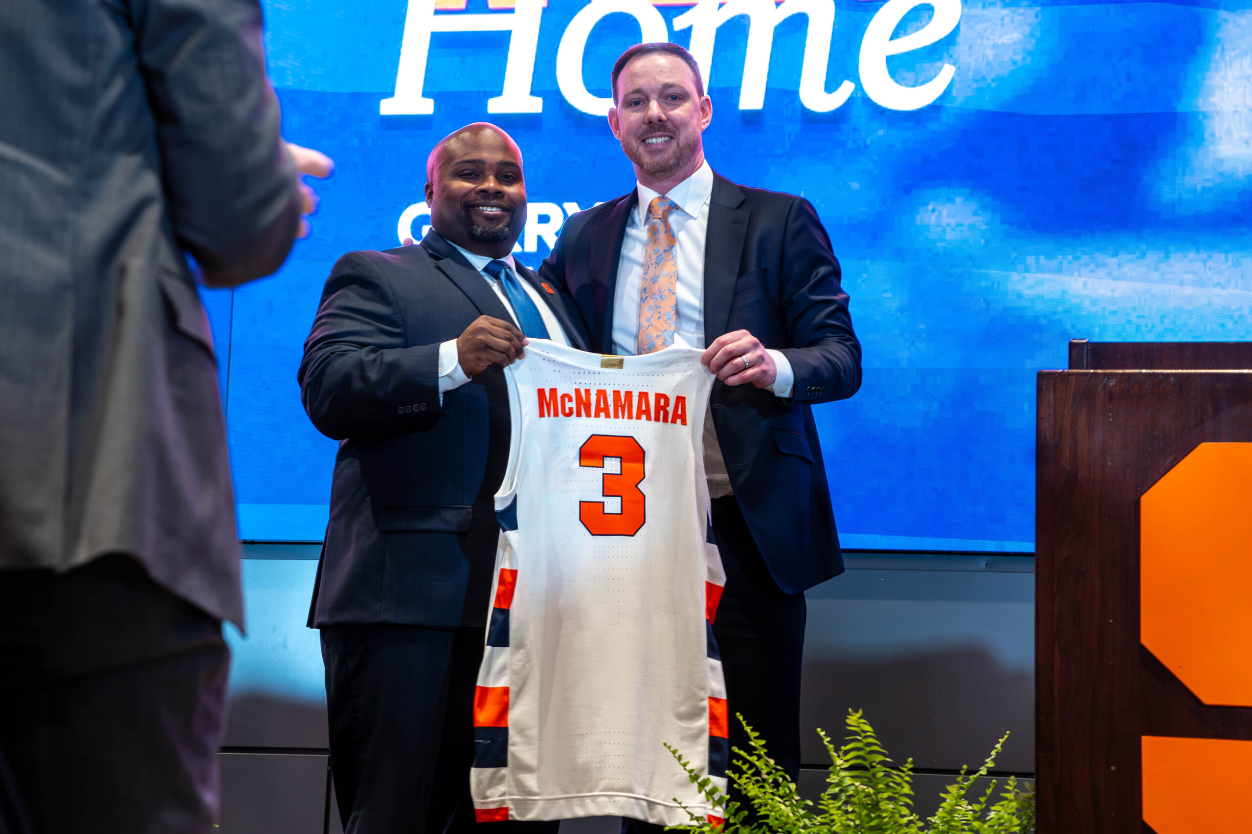 Blair stands holding McNamara jersey